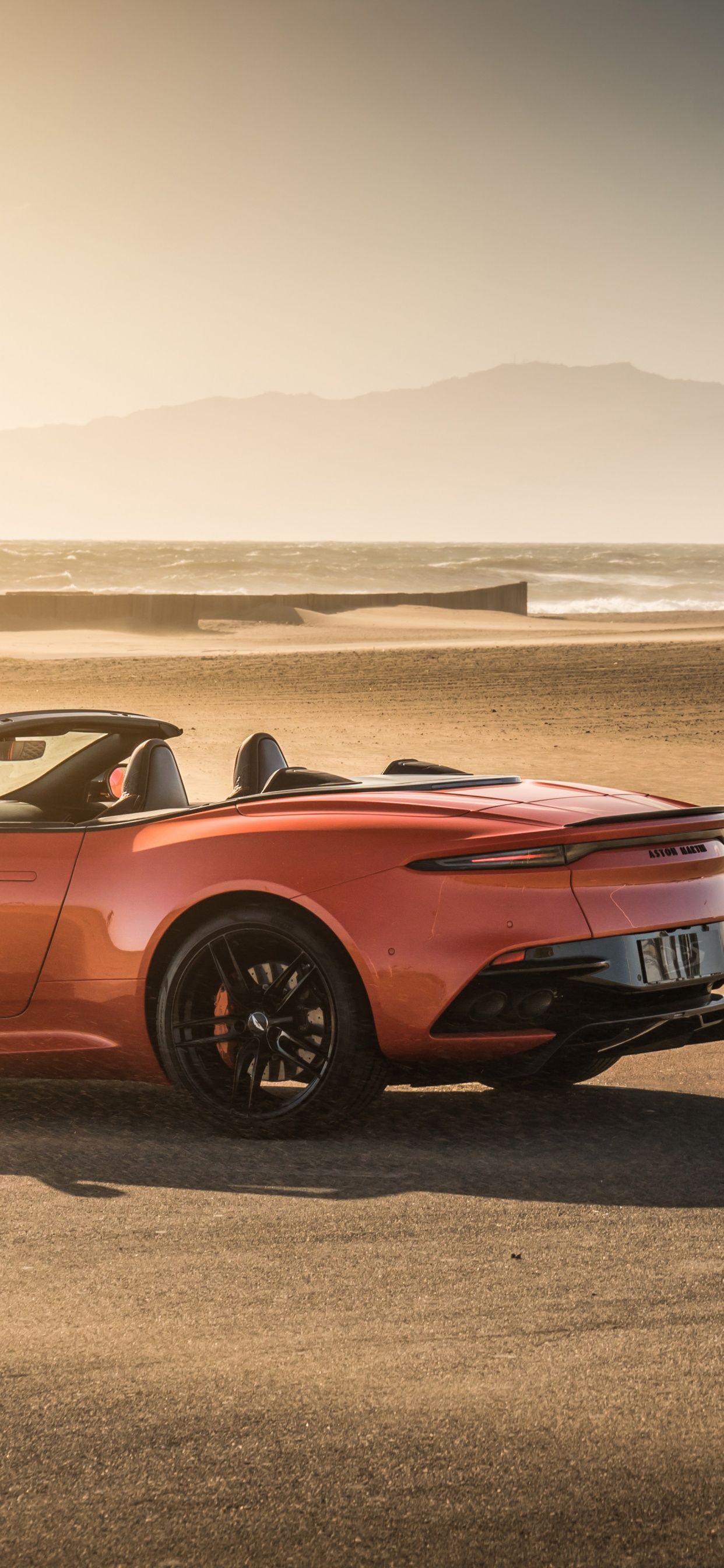 Red Chevrolet Camaro on Beach During Daytime. Wallpaper in 1242x2688 Resolution