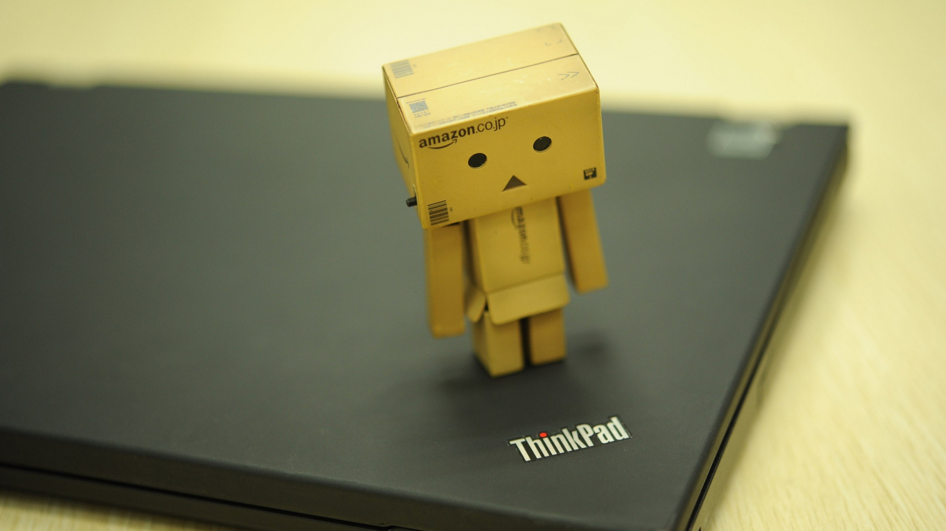 Brown Cardboard Box on Black Lenovo Thinkpad. Wallpaper in 1366x768 Resolution