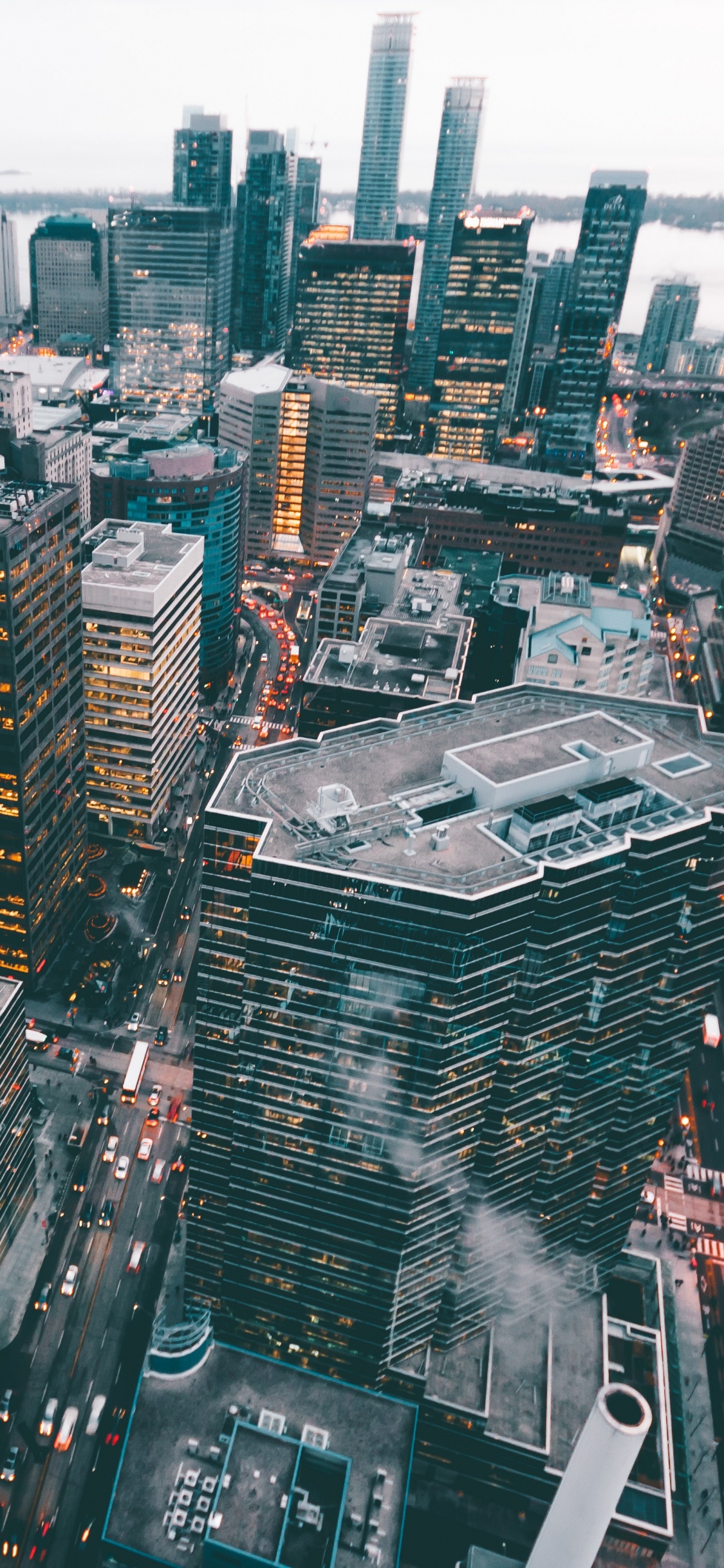 Luftaufnahme Von Stadtgebäuden Tagsüber. Wallpaper in 1125x2436 Resolution