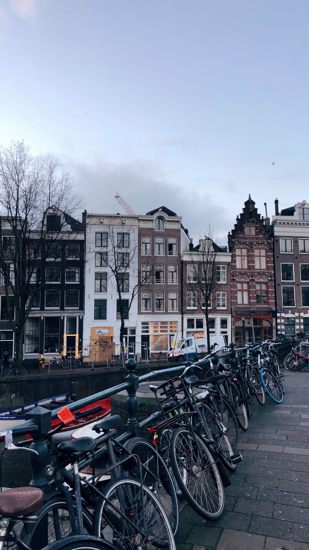 Bicycles Parked Beside Concrete Building During Daytime. Wallpaper in 1080x1920 Resolution
