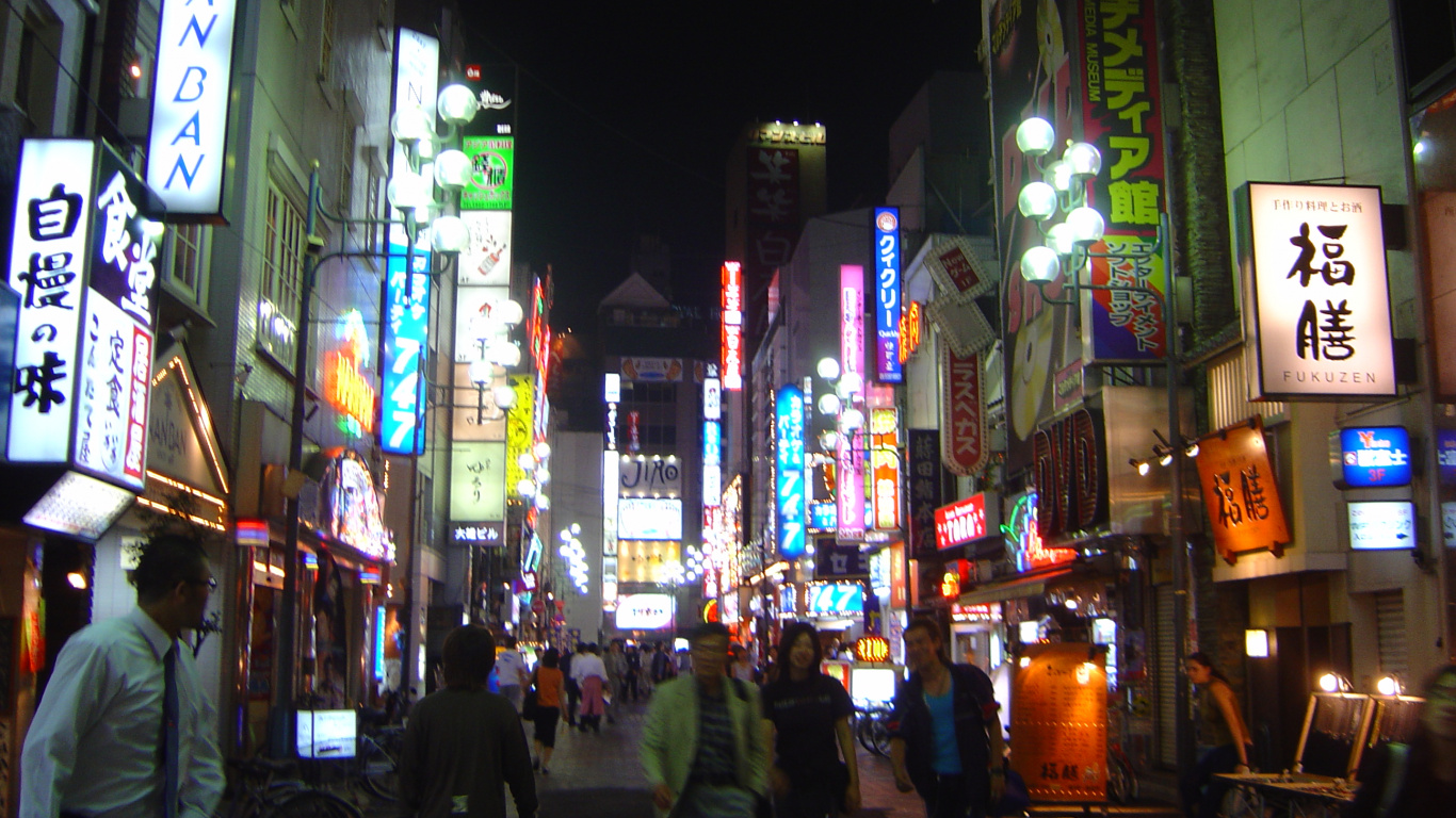 People Walking on Street During Night Time. Wallpaper in 1366x768 Resolution