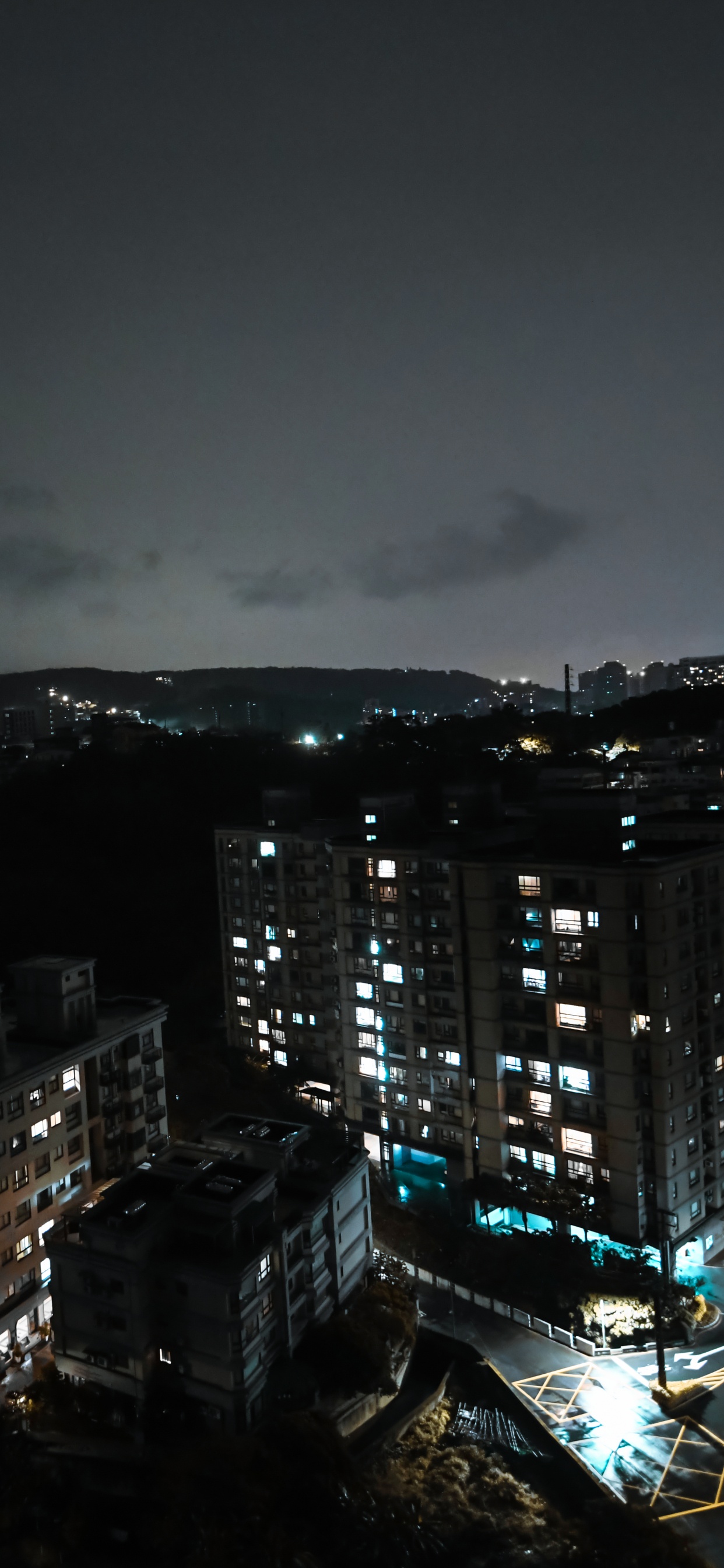 City Skyline During Night Time. Wallpaper in 1242x2688 Resolution