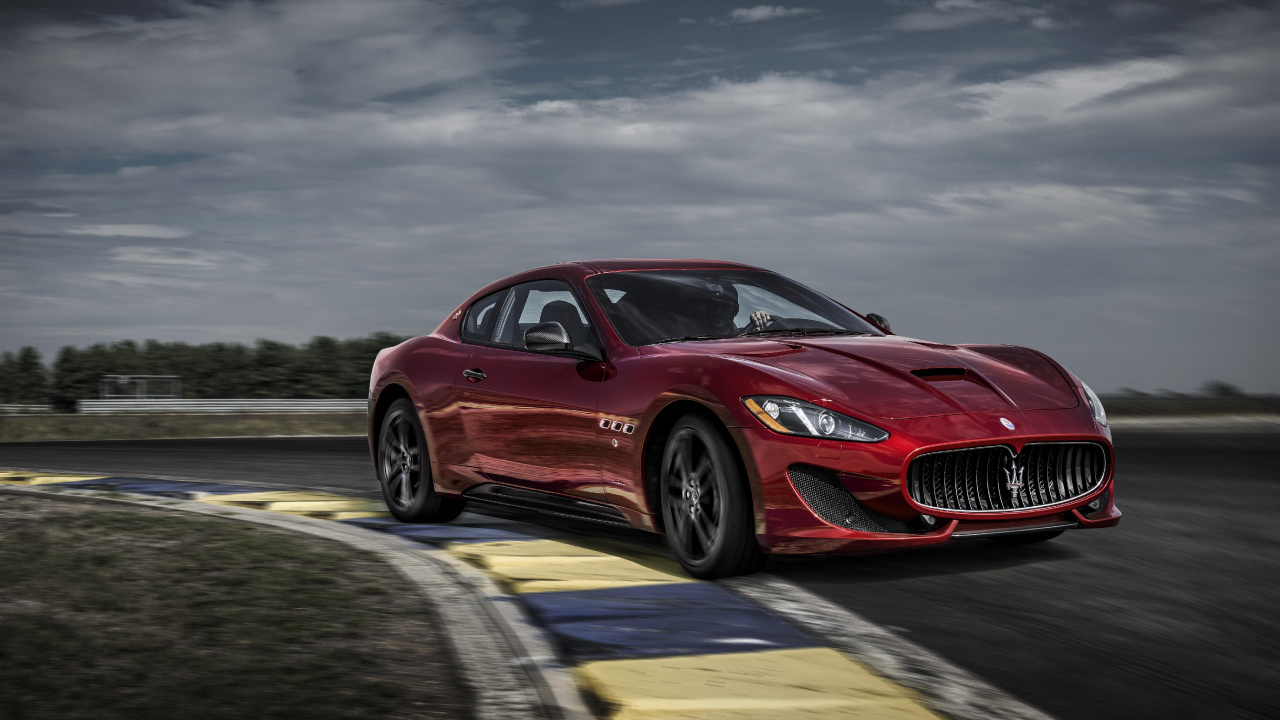 Red Porsche 911 on Road Under Cloudy Sky. Wallpaper in 1280x720 Resolution