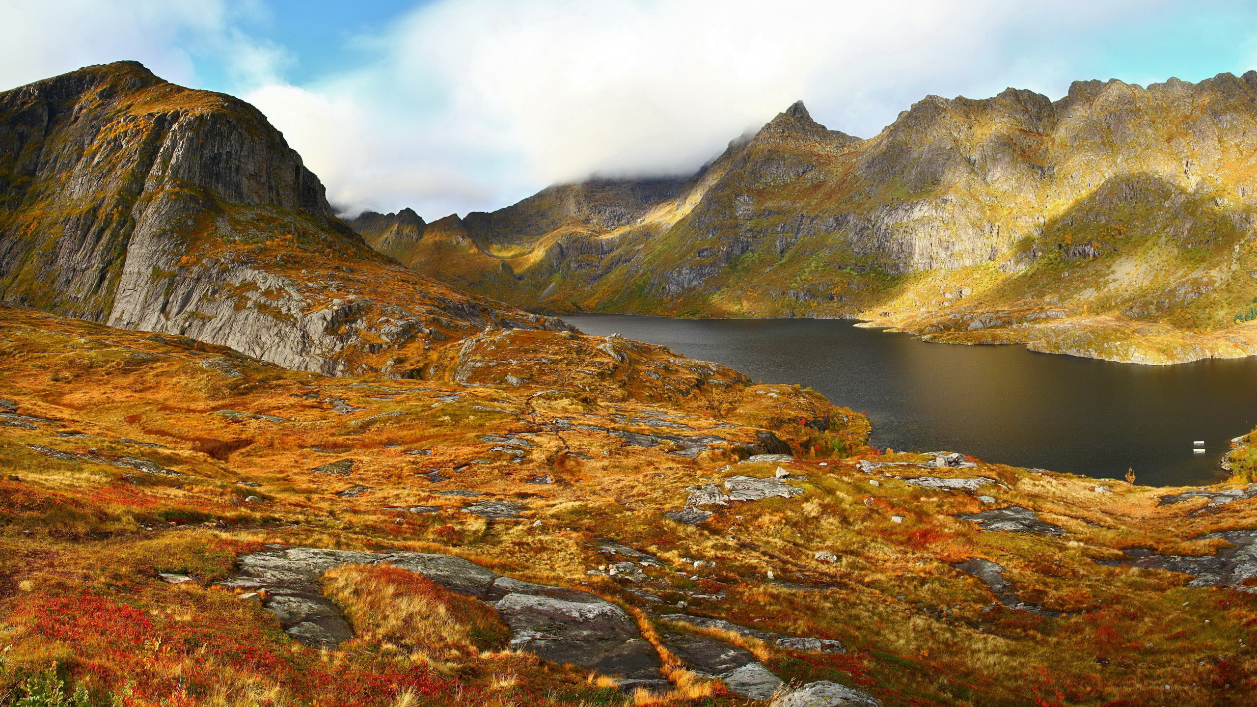 Brown and Green Mountain Beside Lake Under Blue Sky During Daytime. Wallpaper in 2560x1440 Resolution