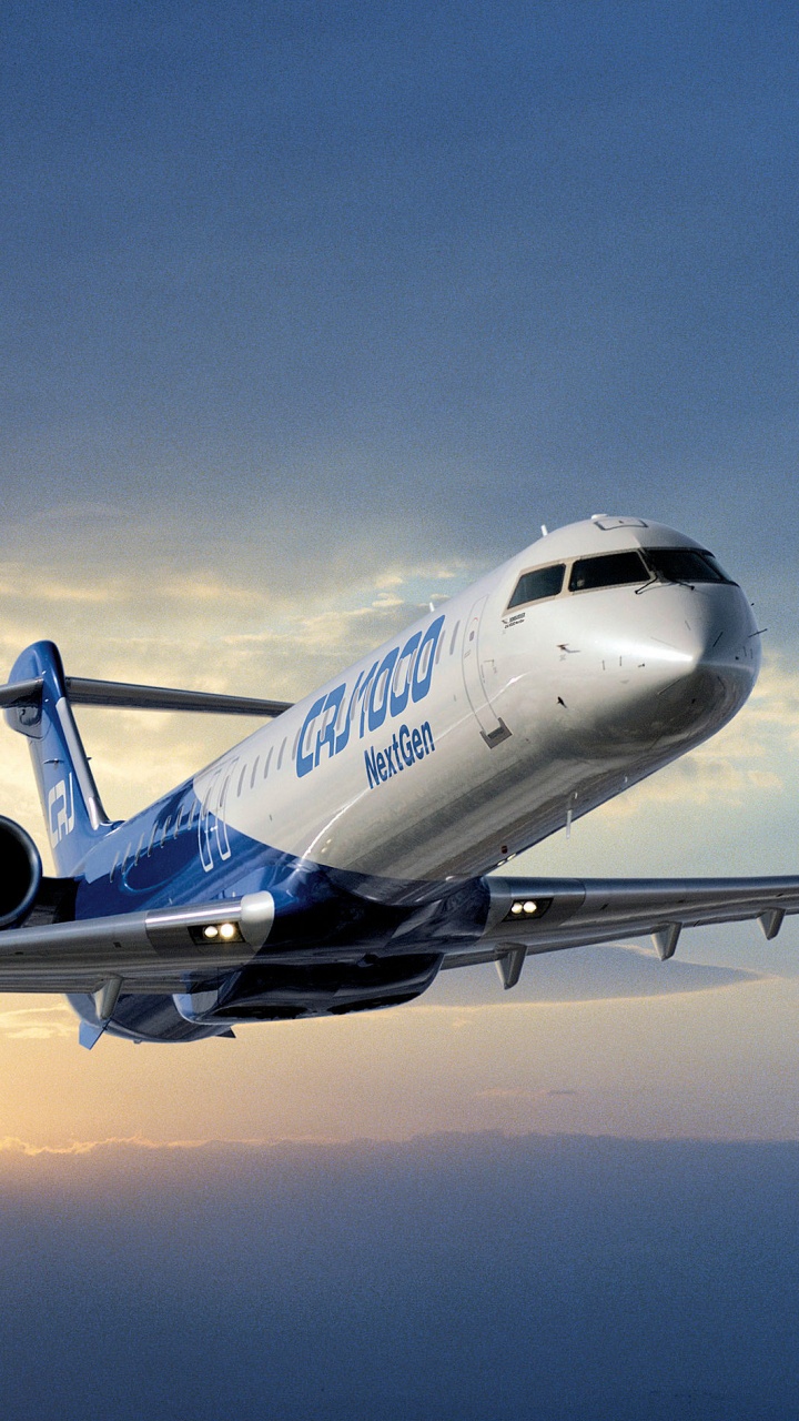 White and Blue Passenger Plane in Flight. Wallpaper in 720x1280 Resolution