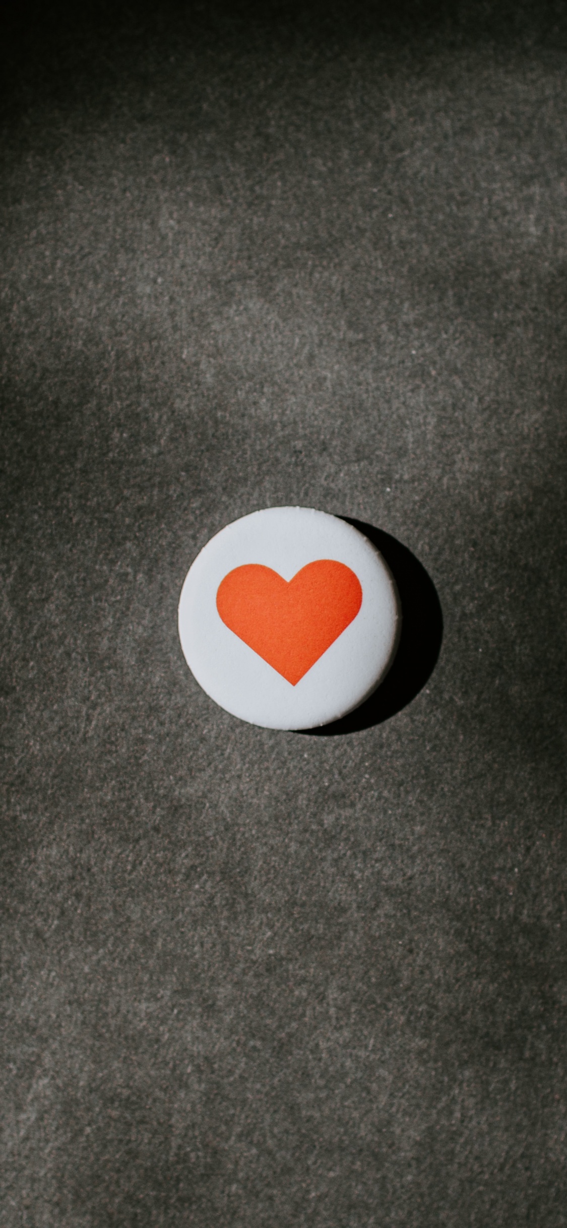 White and Orange Round Ornament. Wallpaper in 1125x2436 Resolution