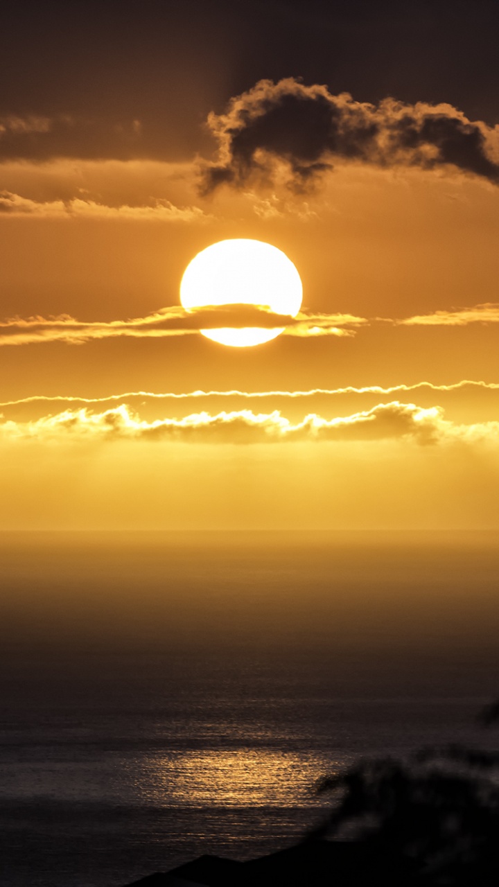 Puesta de Sol Sobre el Océano. Wallpaper in 720x1280 Resolution