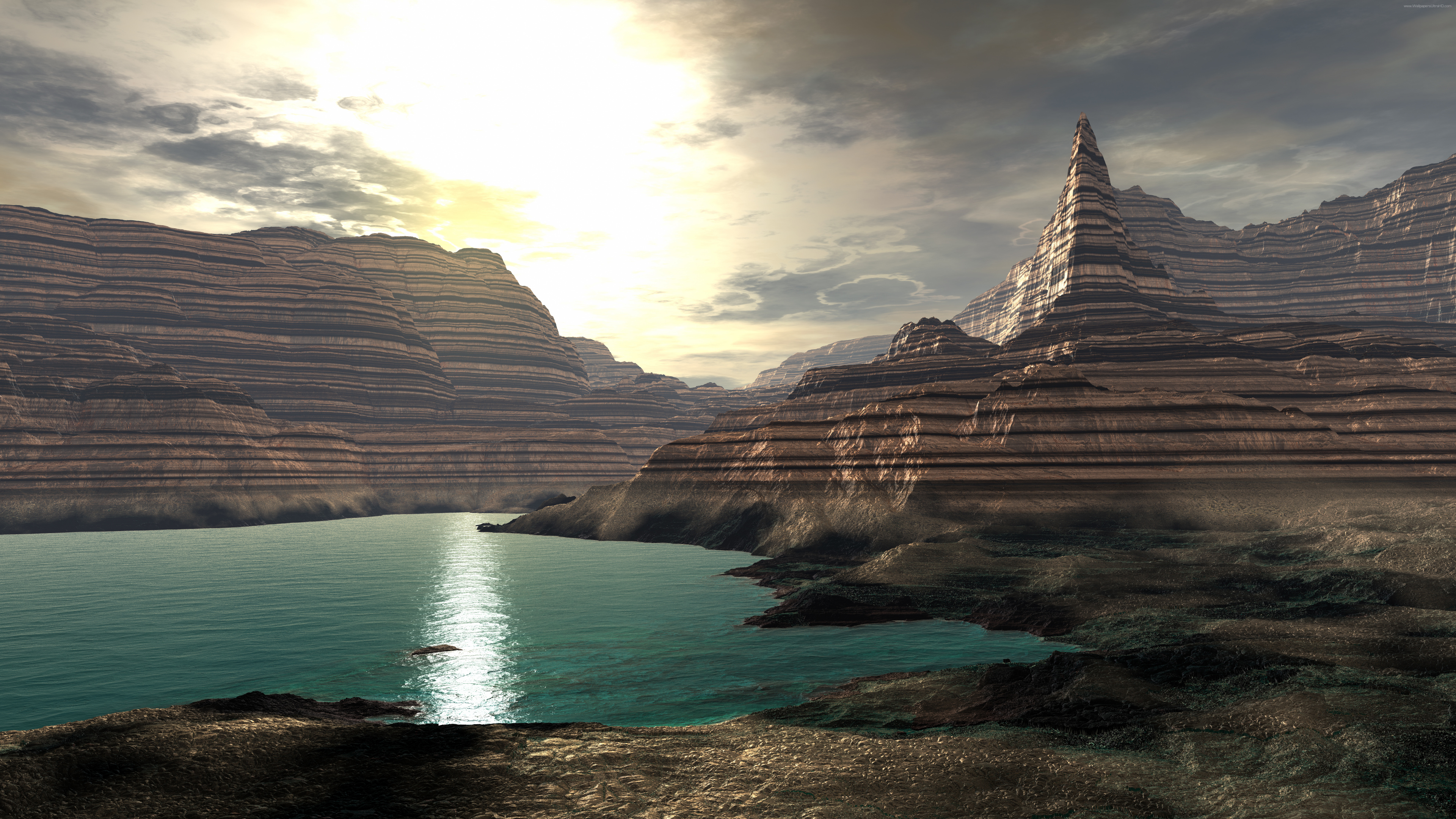 Brown Rocky Mountain Beside Body of Water During Daytime. Wallpaper in 3840x2160 Resolution