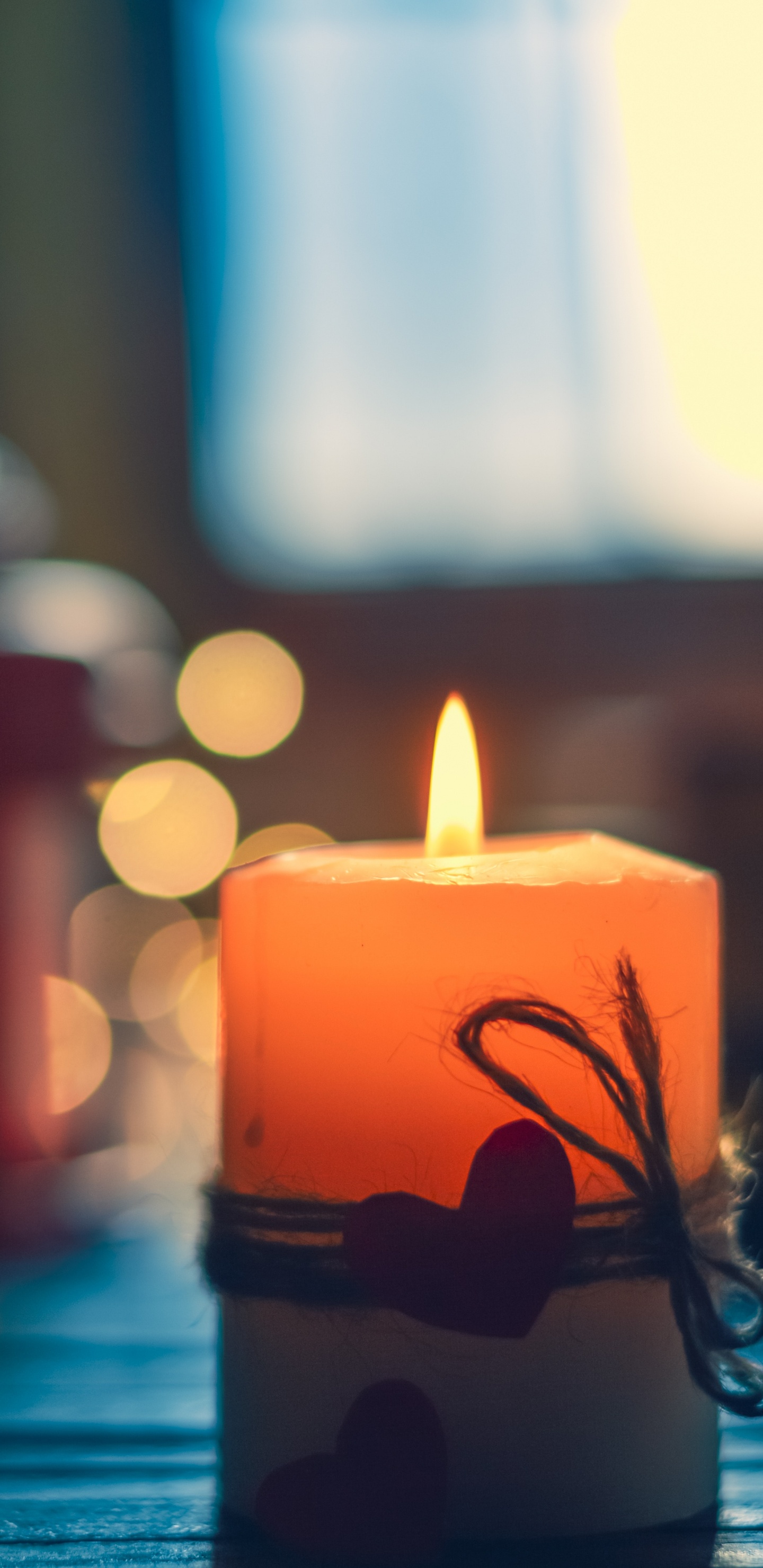 Lighted Candle on Black Metal Candle Holder. Wallpaper in 1440x2960 Resolution