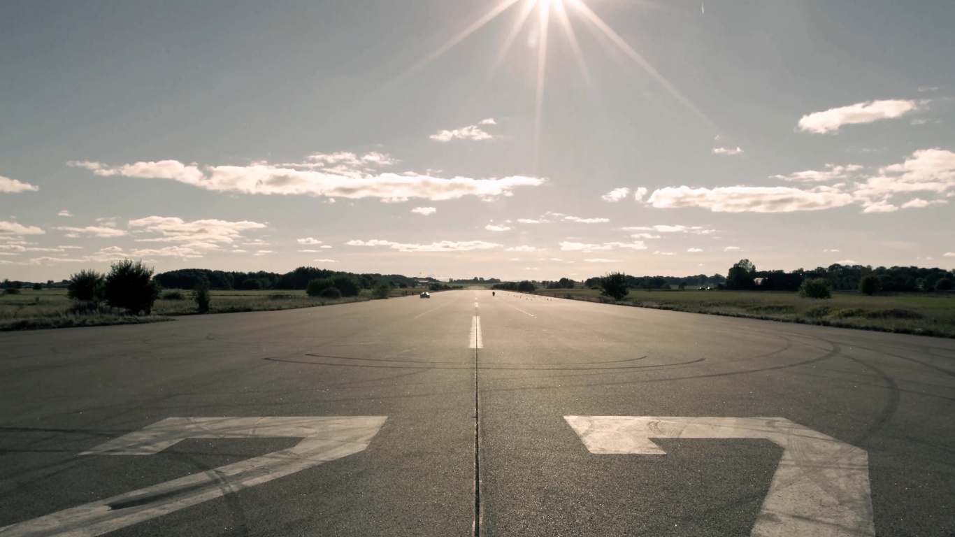 Gray Concrete Road Under White Clouds During Daytime. Wallpaper in 1366x768 Resolution