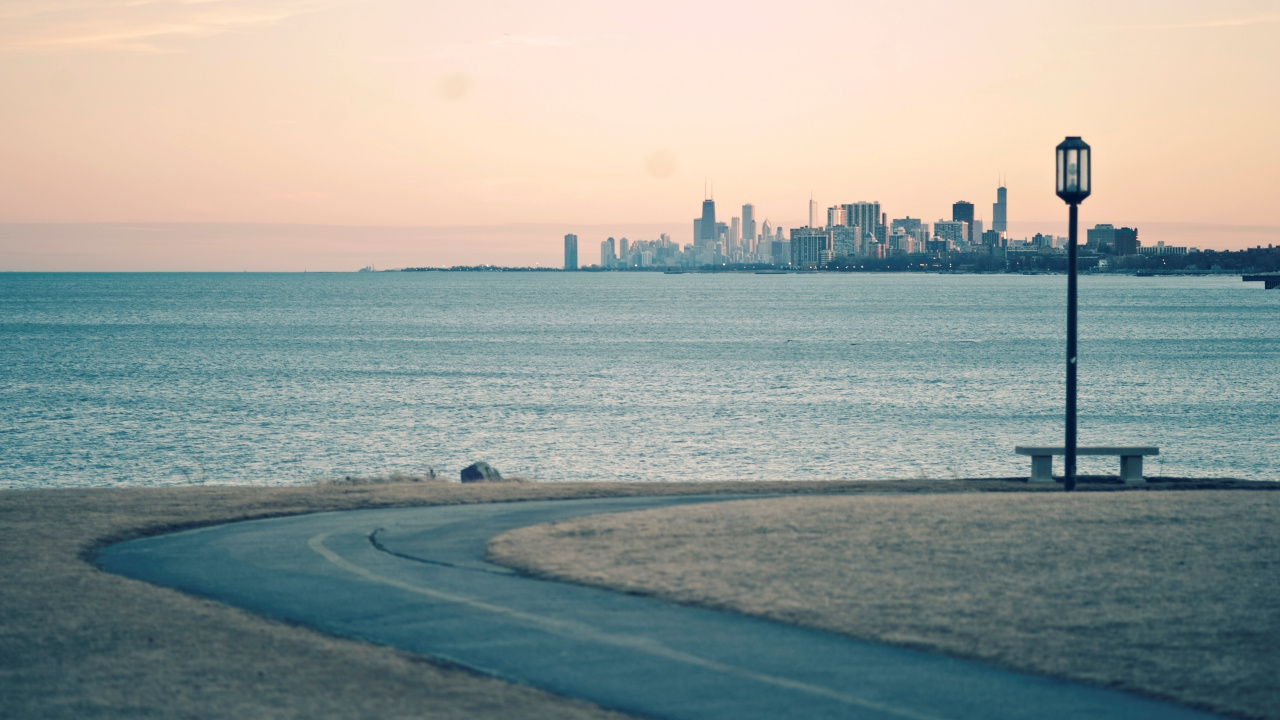 Body of Water Near City Buildings During Daytime. Wallpaper in 1280x720 Resolution