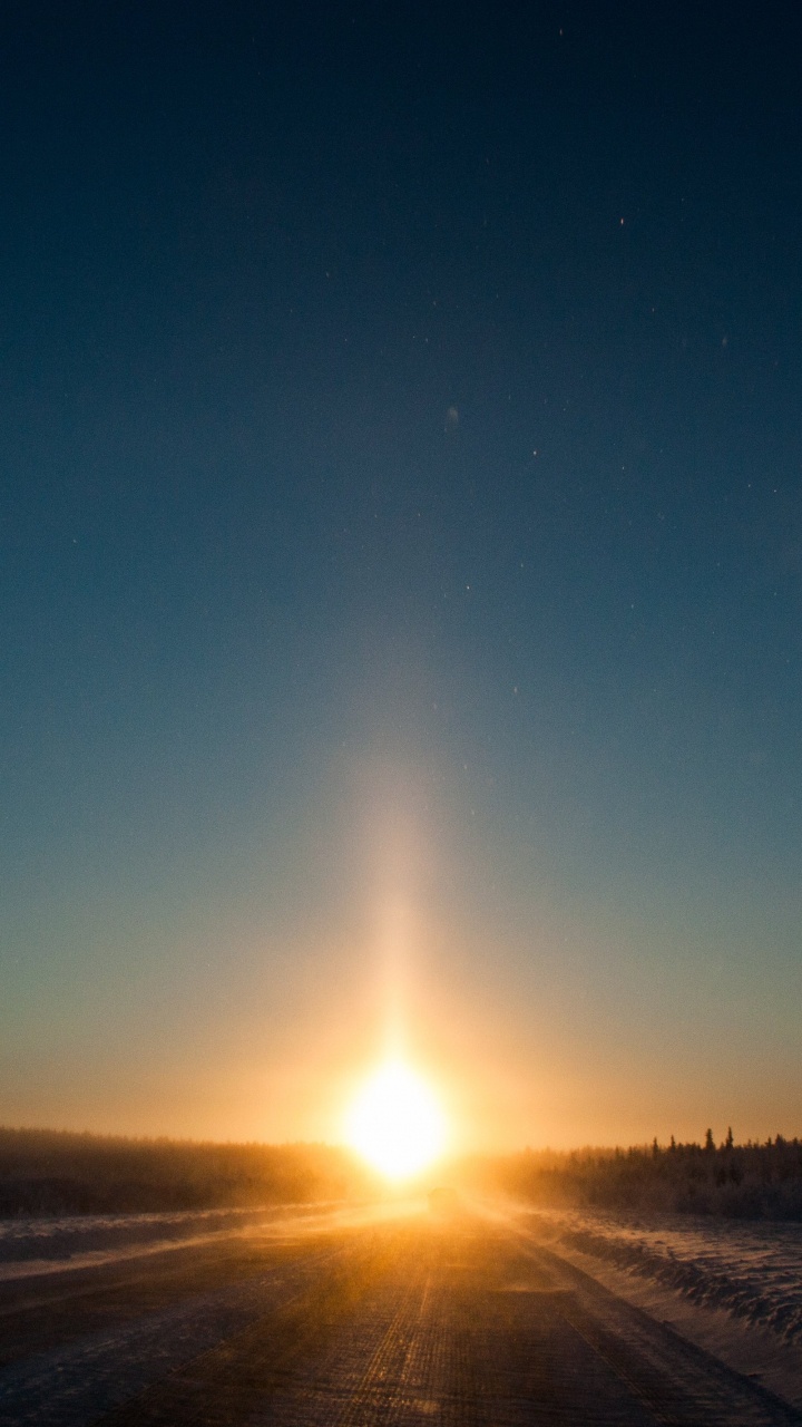 Sun Setting Over The Field. Wallpaper in 720x1280 Resolution