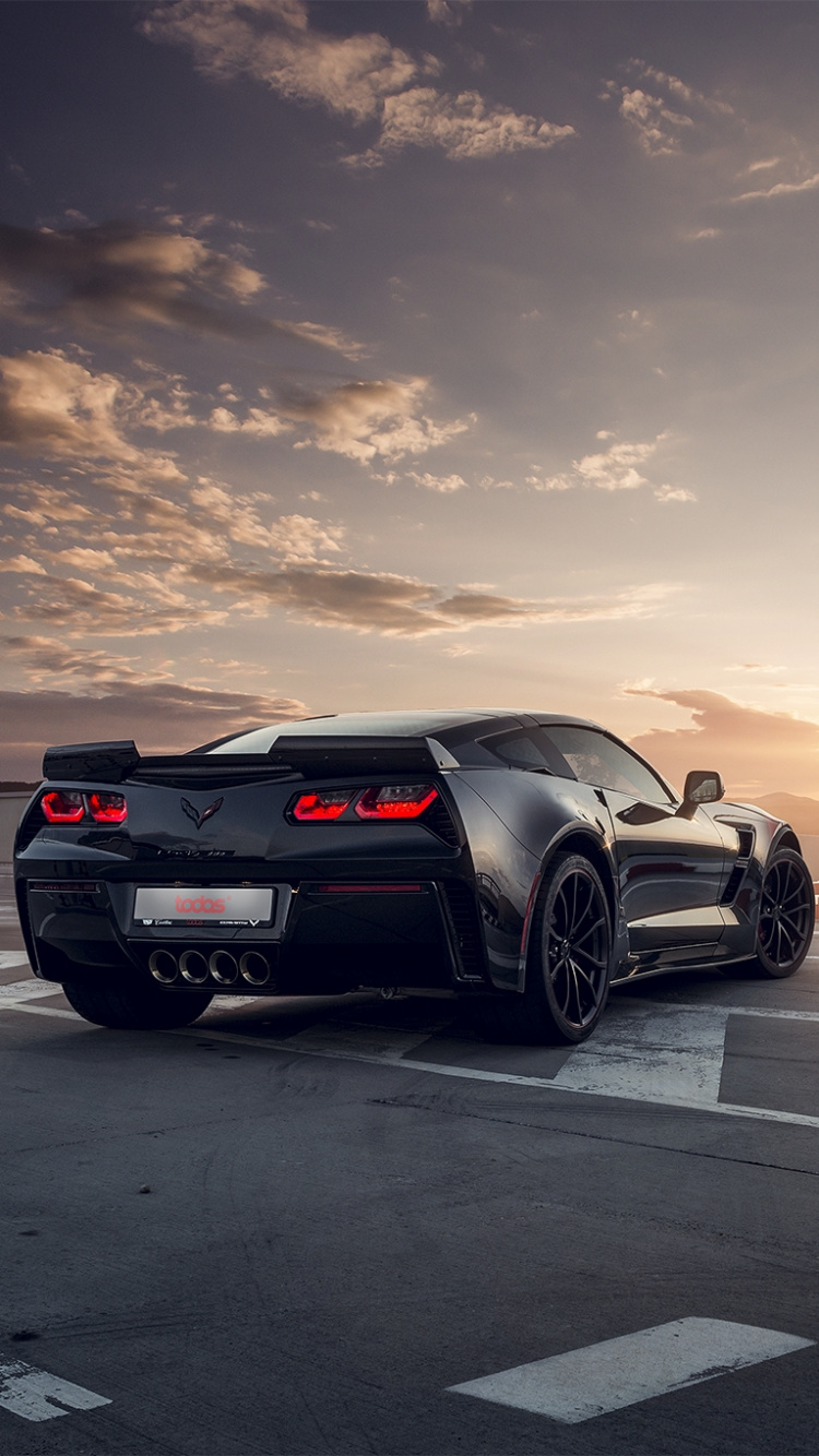 Black Porsche 911 on Road During Sunset. Wallpaper in 750x1334 Resolution