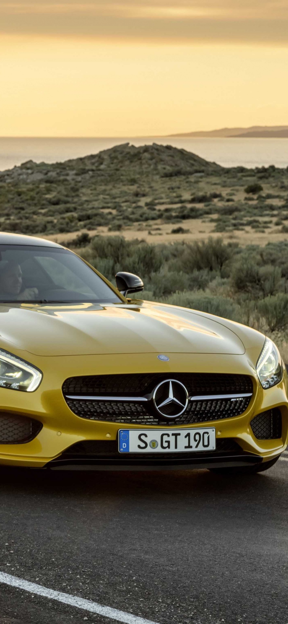 Yellow Mercedes Benz Coupe on Road During Daytime. Wallpaper in 1125x2436 Resolution