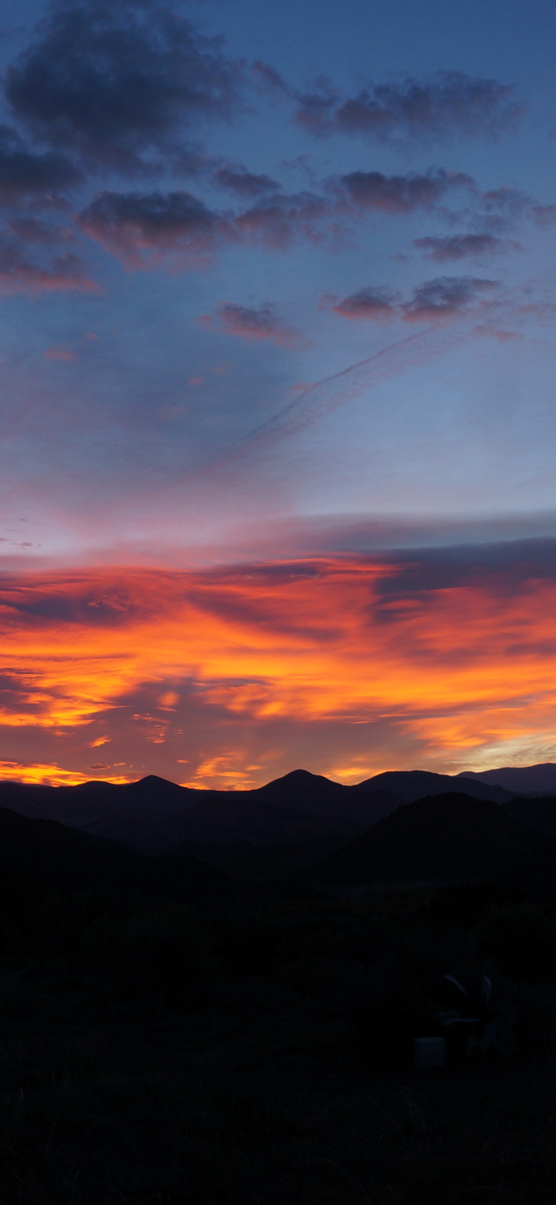 Silhouette of Mountains During Sunset. Wallpaper in 1125x2436 Resolution