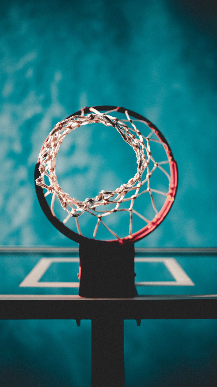 Basketball Hoop With Blue Background. Wallpaper in 750x1334 Resolution