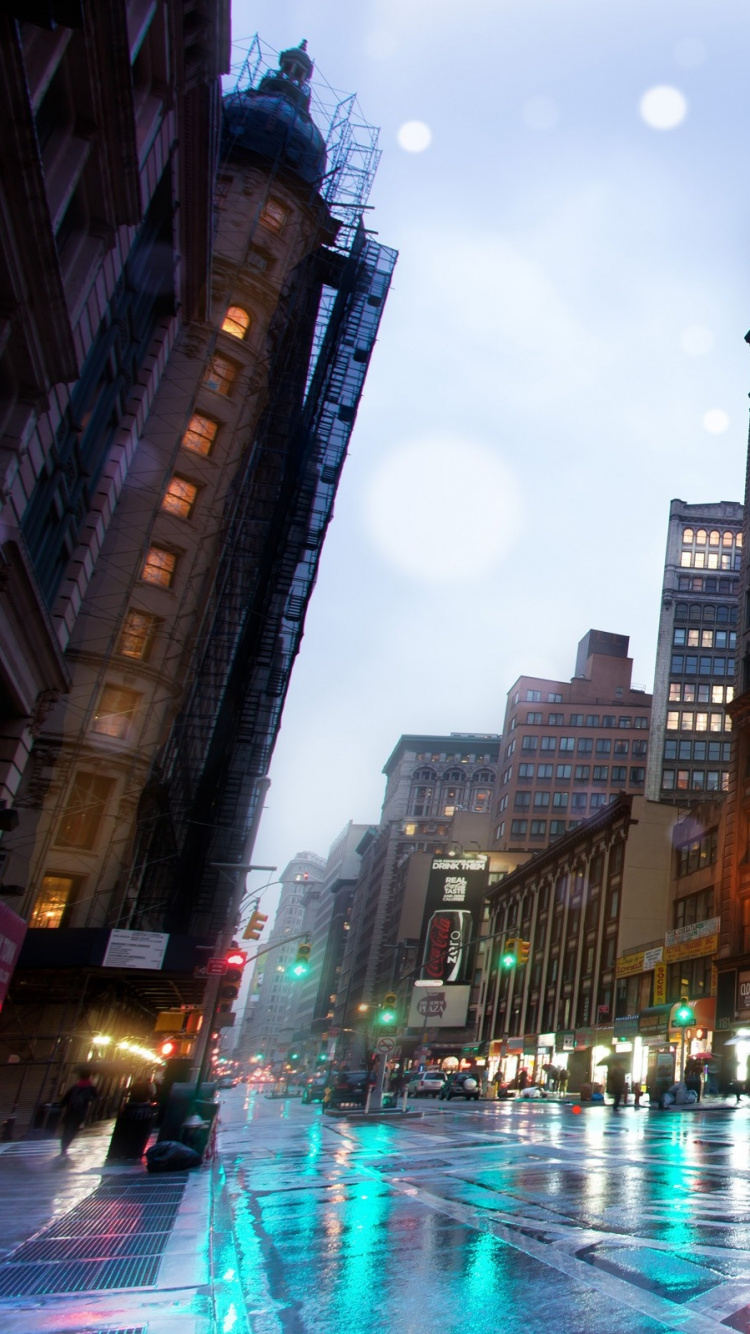 Cars on Road Between High Rise Buildings During Night Time. Wallpaper in 750x1334 Resolution