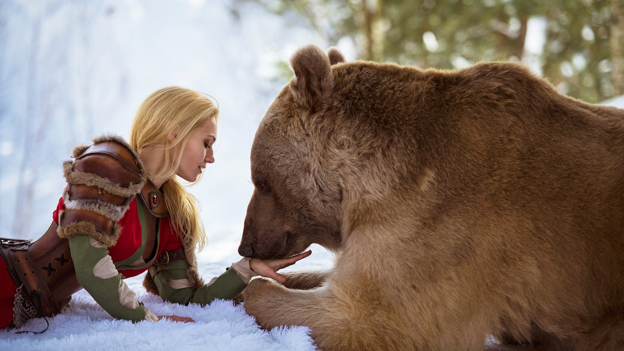 Girl in Red Jacket Beside Brown Bear on Snow Covered Ground During Daytime. Wallpaper in 1280x720 Resolution