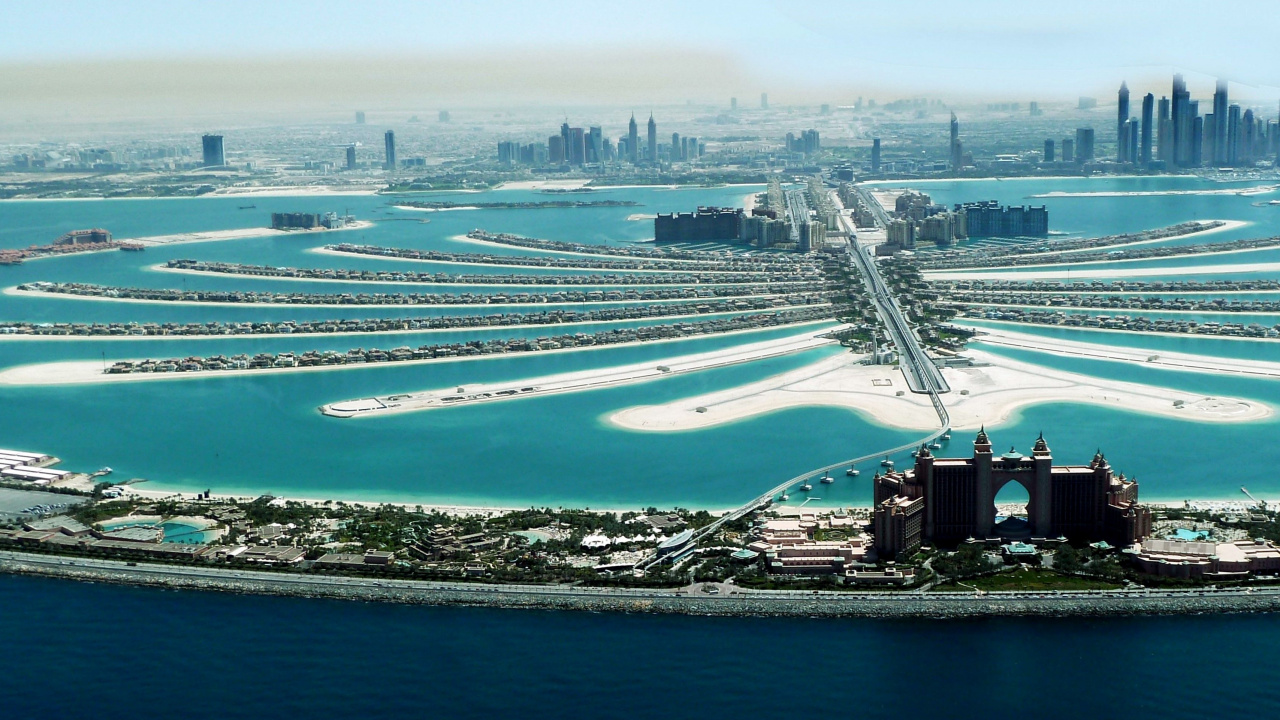 Aerial View of City Buildings Near Body of Water During Daytime. Wallpaper in 1280x720 Resolution