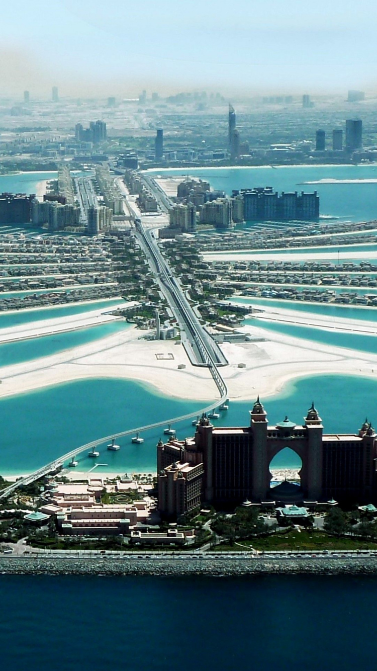 Aerial View of City Buildings Near Body of Water During Daytime. Wallpaper in 750x1334 Resolution