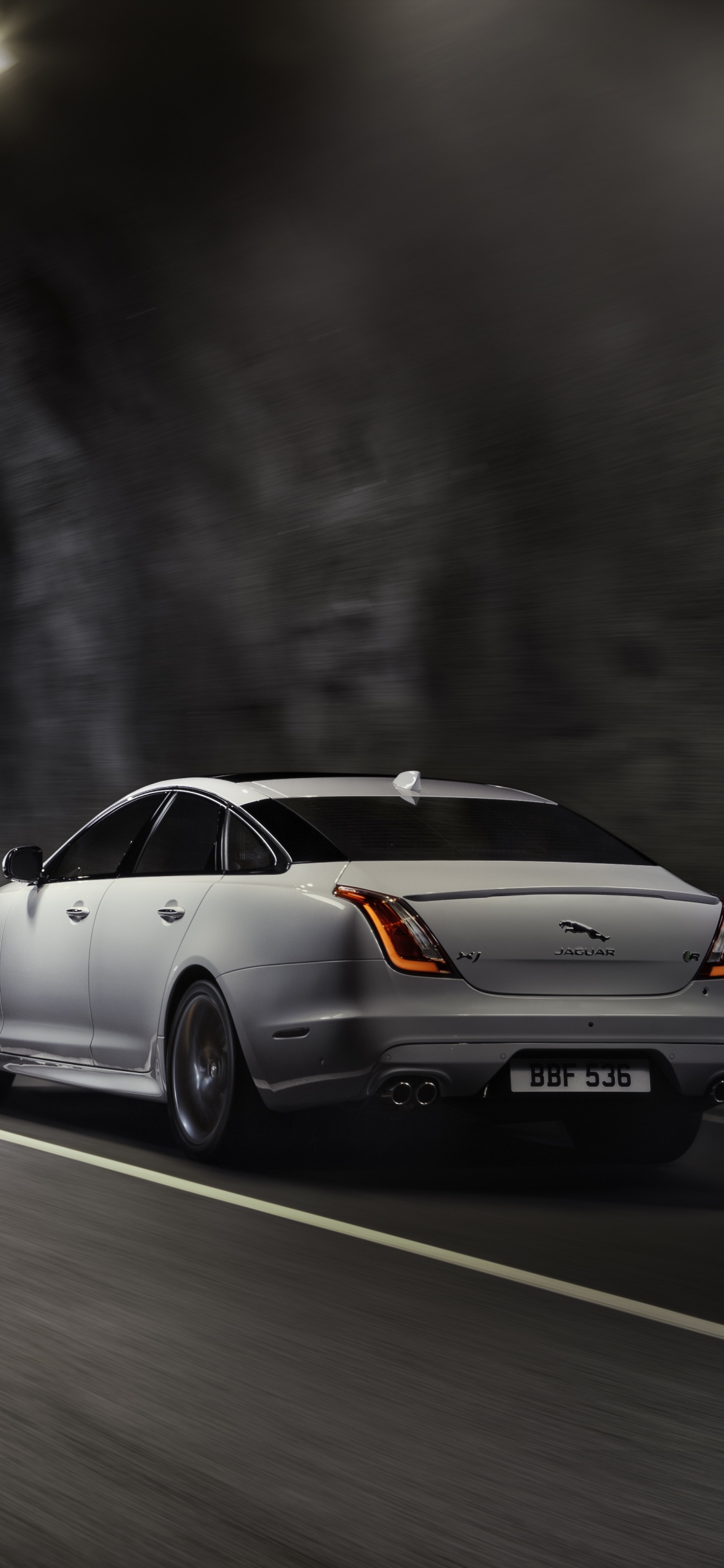 White Sedan on Road During Daytime. Wallpaper in 1125x2436 Resolution