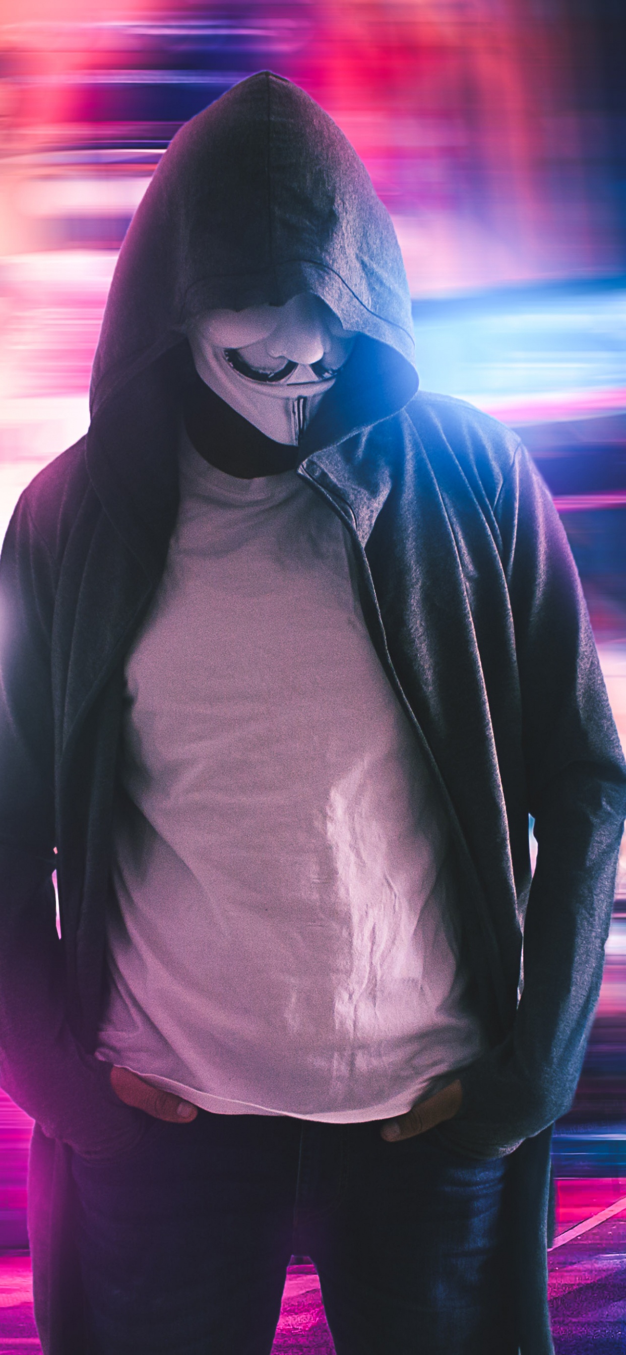 Man in Black and White Hoodie Standing on Road During Night Time. Wallpaper in 1242x2688 Resolution