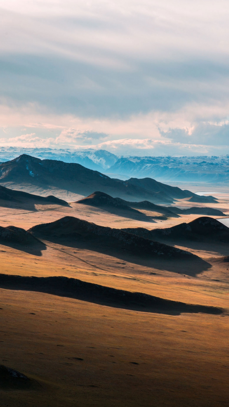 Brown Sand Under White Clouds During Daytime. Wallpaper in 750x1334 Resolution