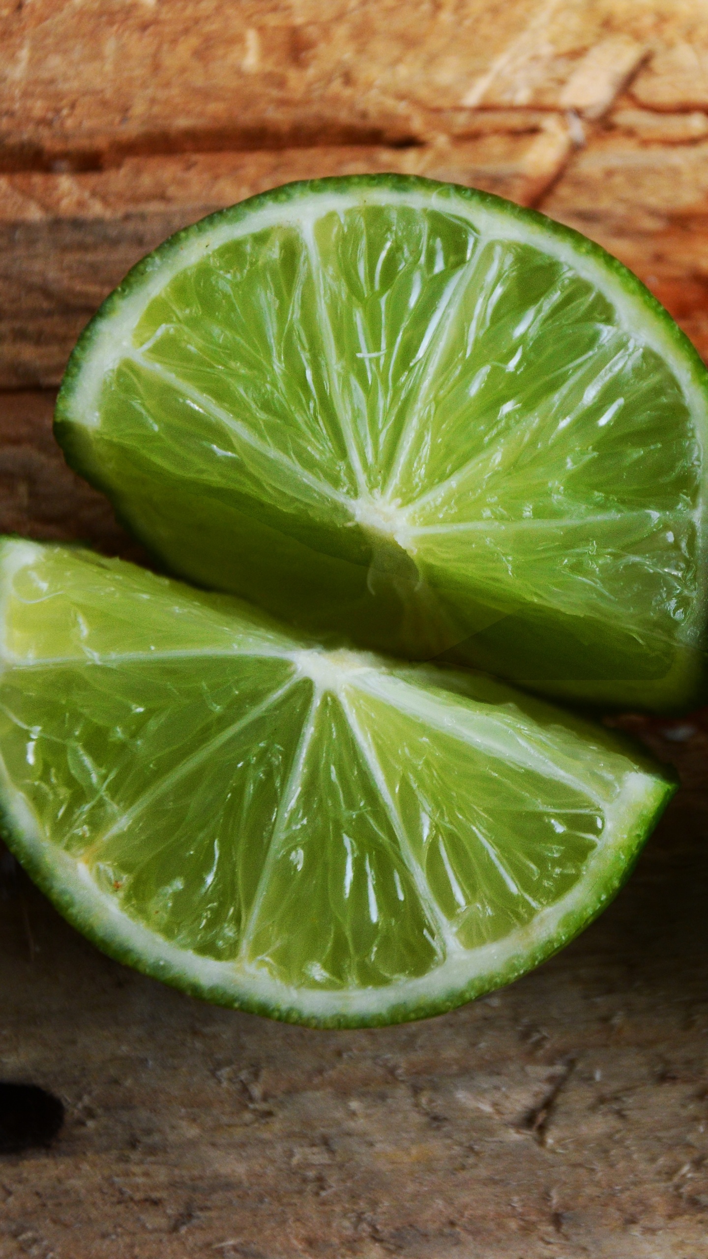 Sliced Lemon on Brown Brick Wall. Wallpaper in 1440x2560 Resolution