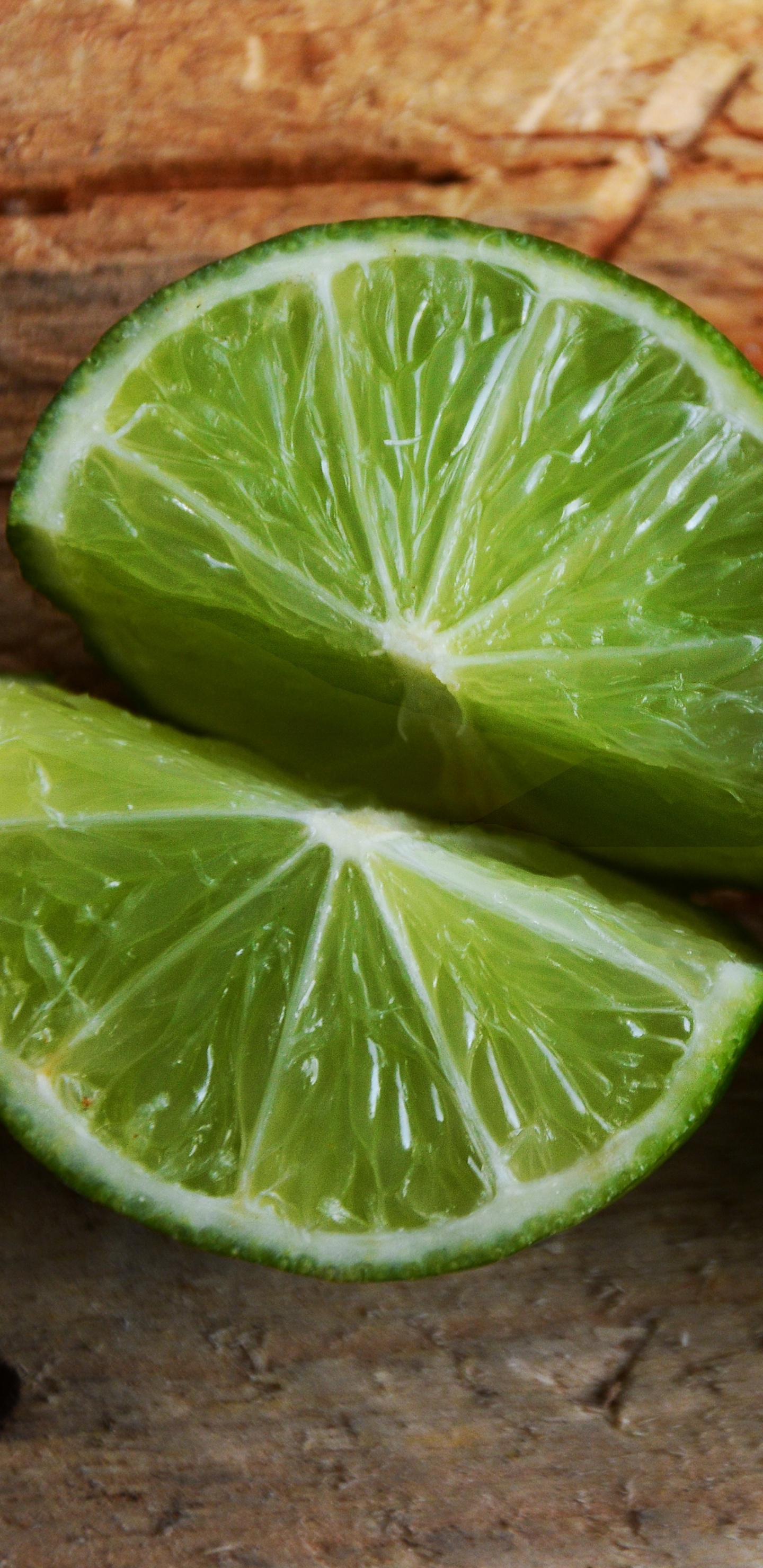 Sliced Lemon on Brown Brick Wall. Wallpaper in 1440x2960 Resolution