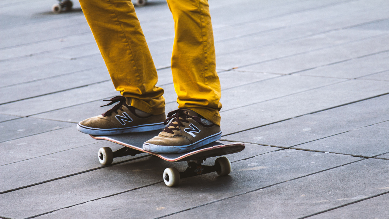 Person in Blue Denim Jeans and Blue Nike Sneakers Riding on Blue Skateboard. Wallpaper in 1280x720 Resolution