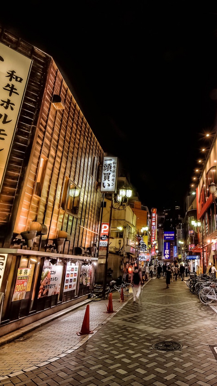 People Walking on Street During Night Time. Wallpaper in 720x1280 Resolution