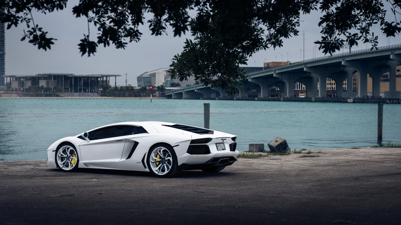 White Porsche 911 Parked Near Body of Water During Daytime. Wallpaper in 1280x720 Resolution