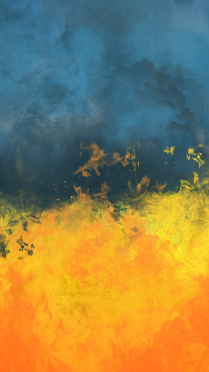 Yellow and Blue Smoke on Green Grass Field. Wallpaper in 720x1280 Resolution