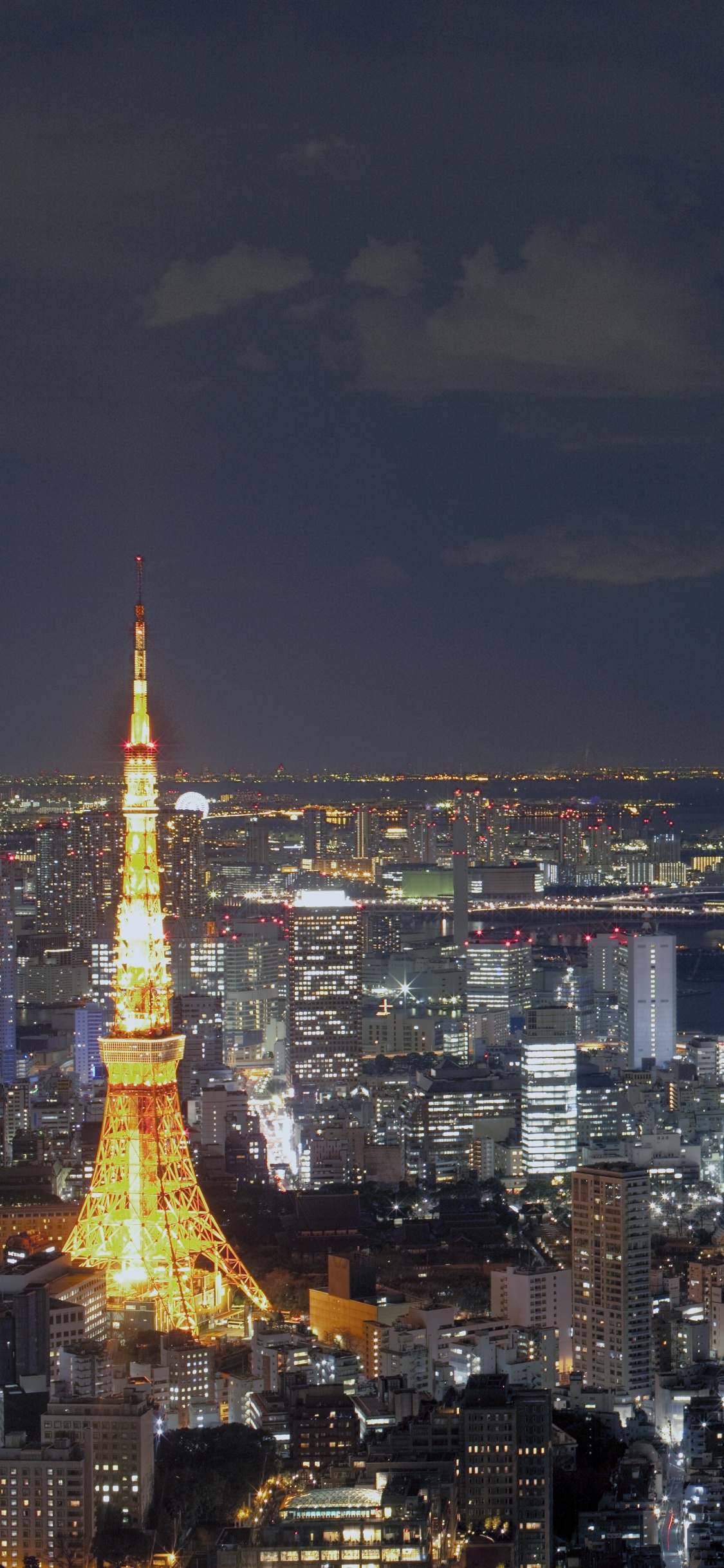 Aerial View of City During Night Time. Wallpaper in 1125x2436 Resolution