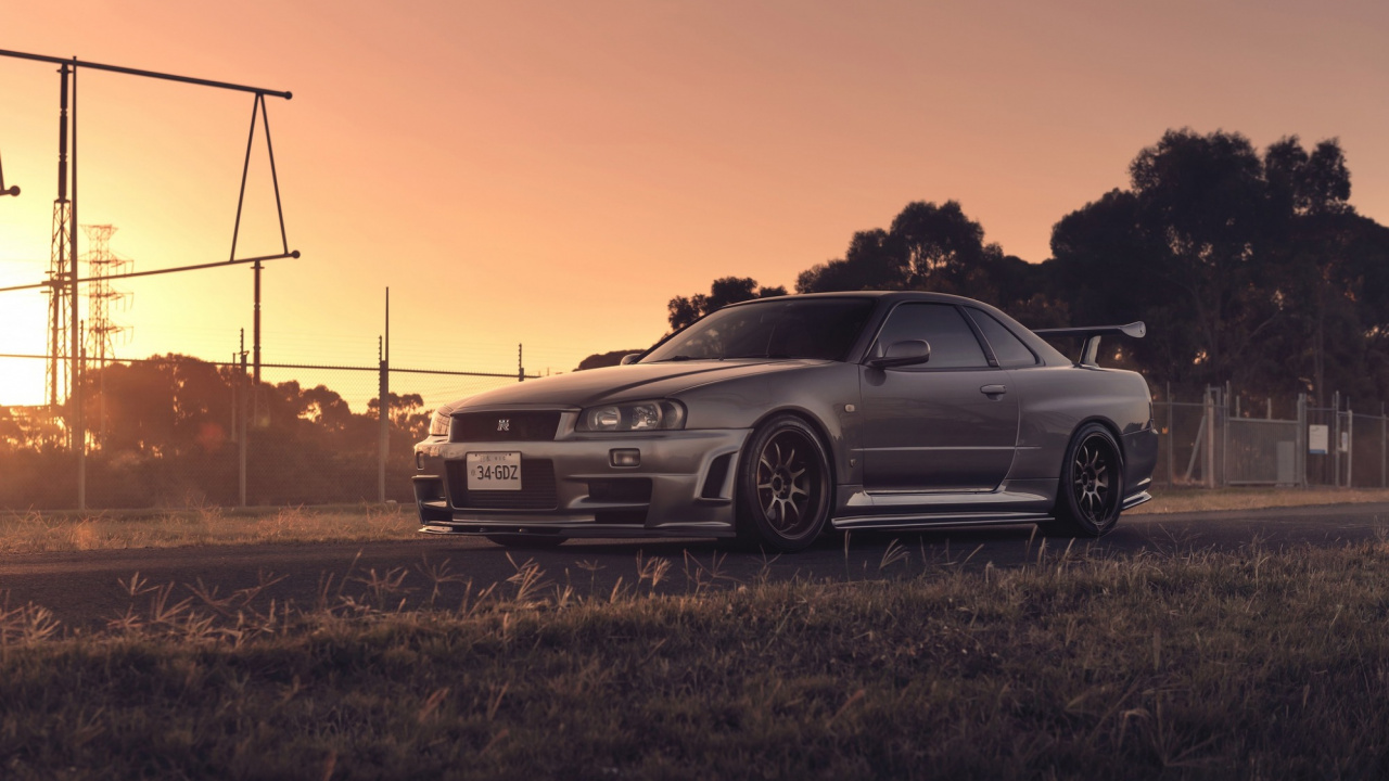 Schwarzes Bmw m 3 Coupe Auf Braunem Rasenfeld Bei Sonnenuntergang. Wallpaper in 1280x720 Resolution