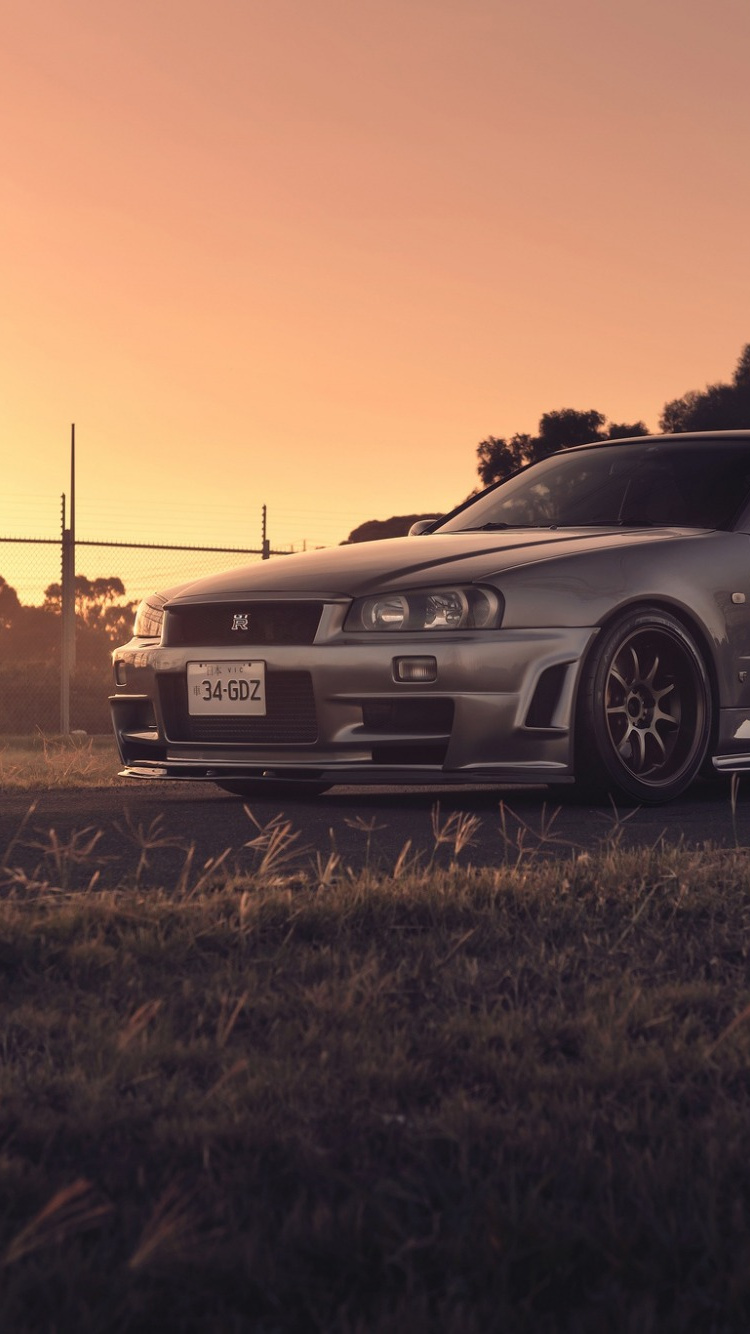 Black Bmw m 3 Coupe on Brown Grass Field During Sunset. Wallpaper in 750x1334 Resolution