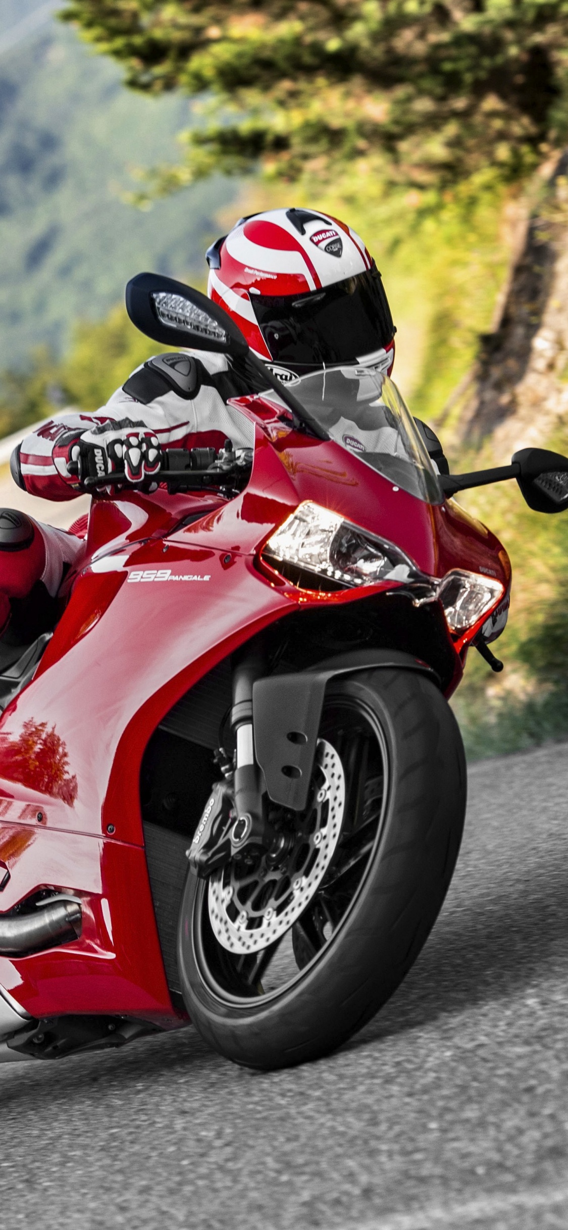 Red and White Sports Bike on Road During Daytime. Wallpaper in 1125x2436 Resolution