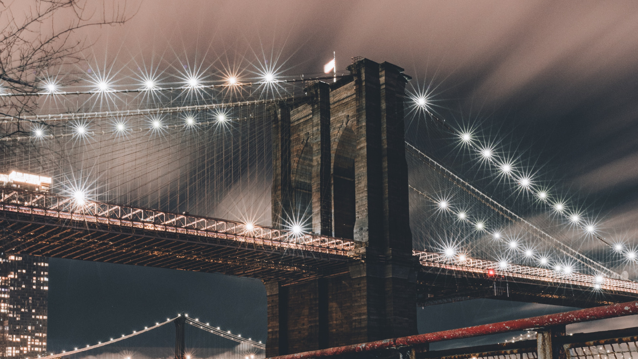 Brown Bridge Over Water During Night Time. Wallpaper in 1280x720 Resolution