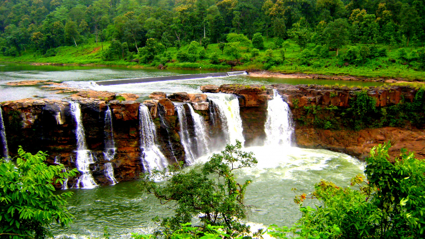 Waterfalls in The Middle of Green Grass Field. Wallpaper in 1366x768 Resolution