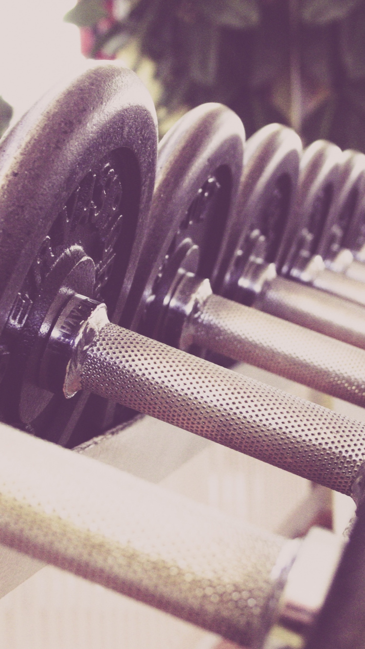 Mancuernas Negras y Grises en Rack. Wallpaper in 750x1334 Resolution