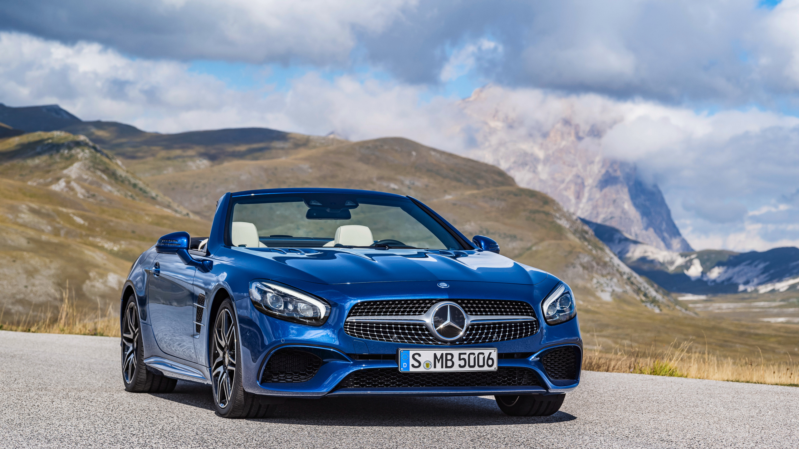 Blue Bmw m 3 on Brown Field Under White Clouds and Blue Sky During Daytime. Wallpaper in 2560x1440 Resolution