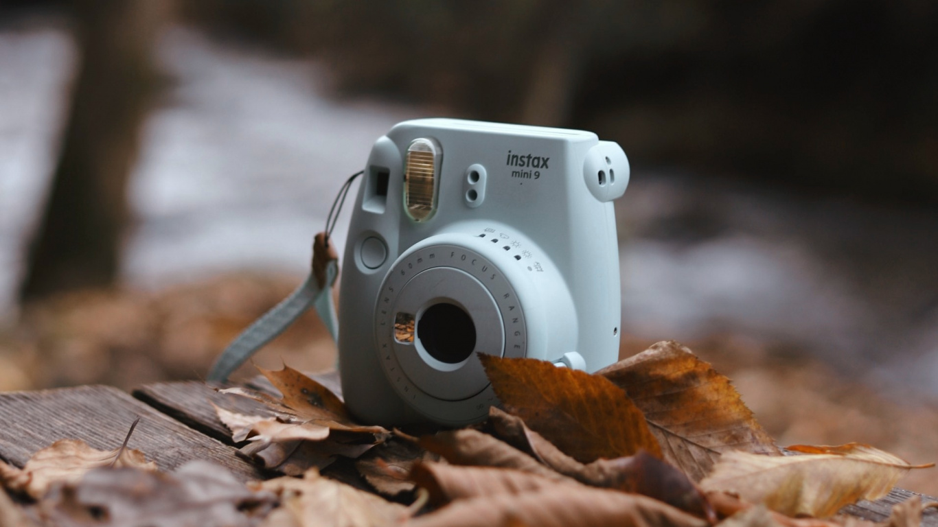 White and Silver Point and Shoot Camera on Brown Wooden Table. Wallpaper in 1366x768 Resolution