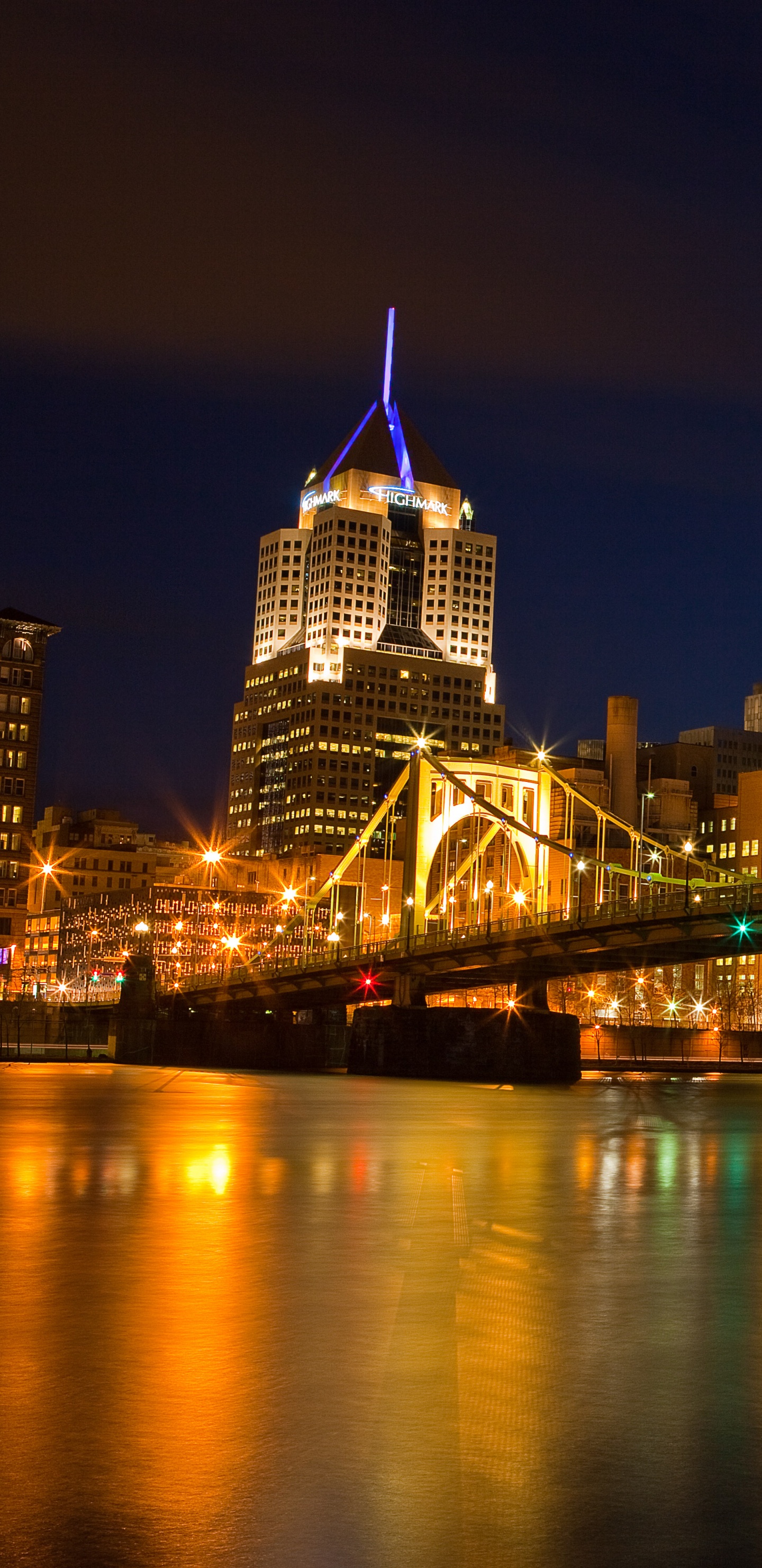 Lighted Bridge Over Water During Night Time. Wallpaper in 1440x2960 Resolution