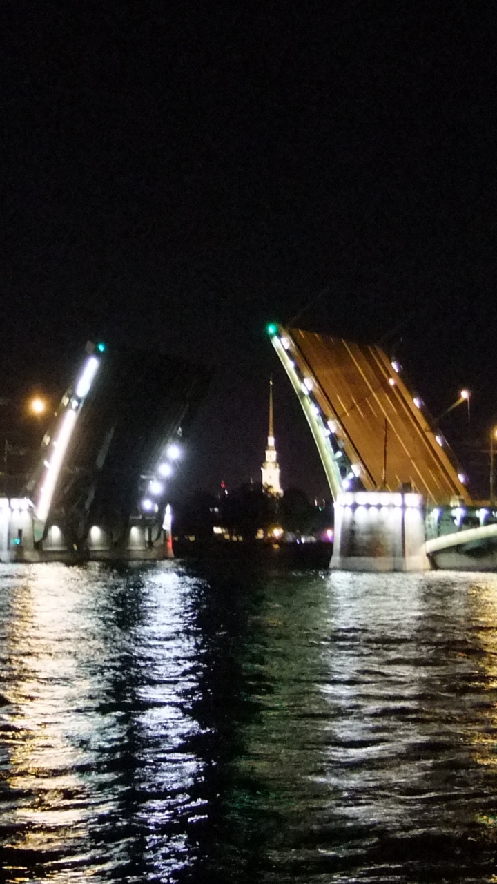 City Lights Turned on During Night Time. Wallpaper in 720x1280 Resolution