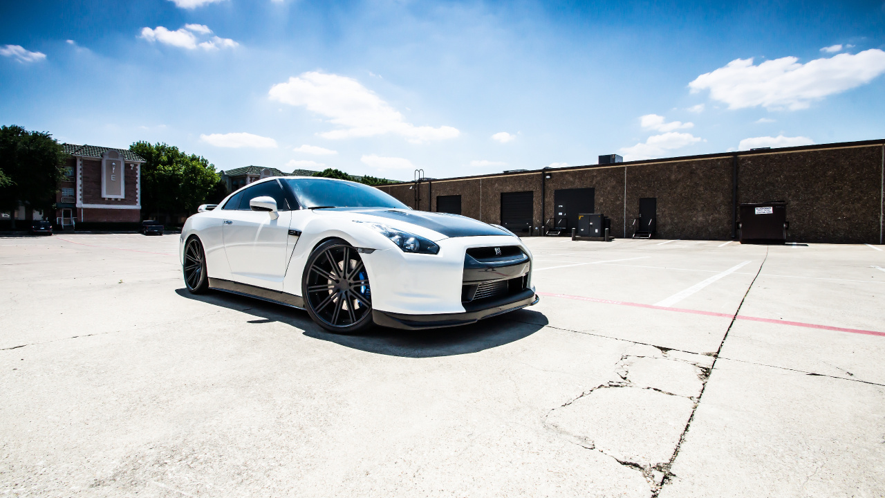 White Coupe Parked on Gray Concrete Floor During Daytime. Wallpaper in 1280x720 Resolution