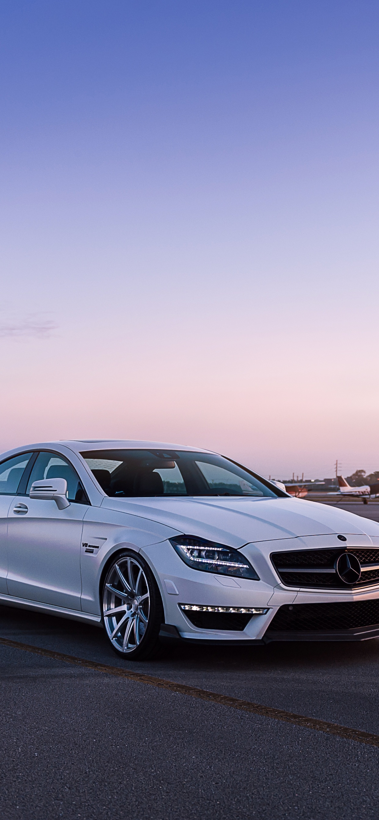 Silver Mercedes Benz Coupe on Road During Sunset. Wallpaper in 1242x2688 Resolution