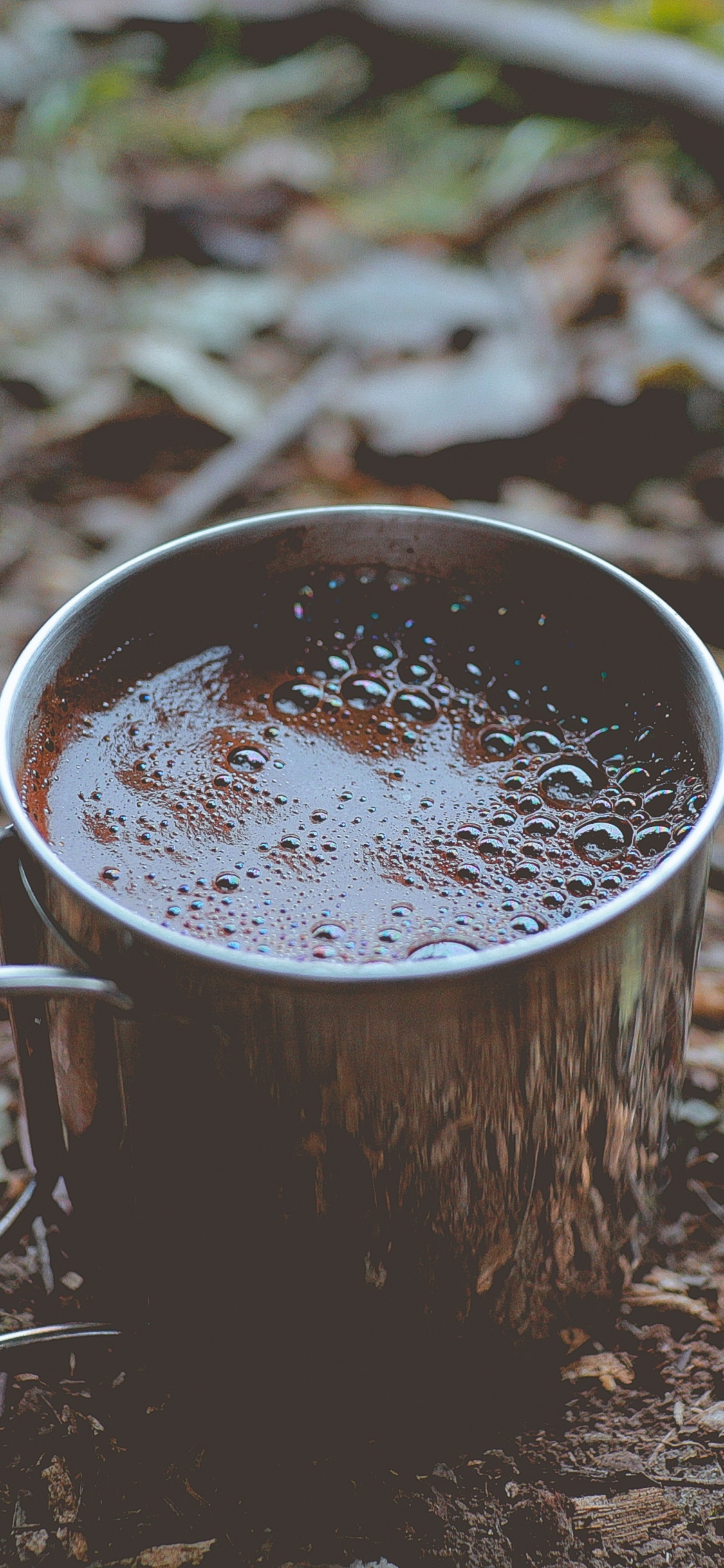Brown Wooden Bucket With White Liquid. Wallpaper in 1125x2436 Resolution
