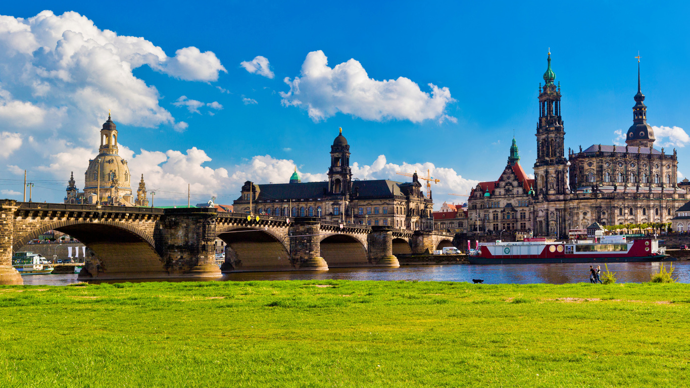 Brown Concrete Bridge Over River Under Blue Sky During Daytime. Wallpaper in 1366x768 Resolution