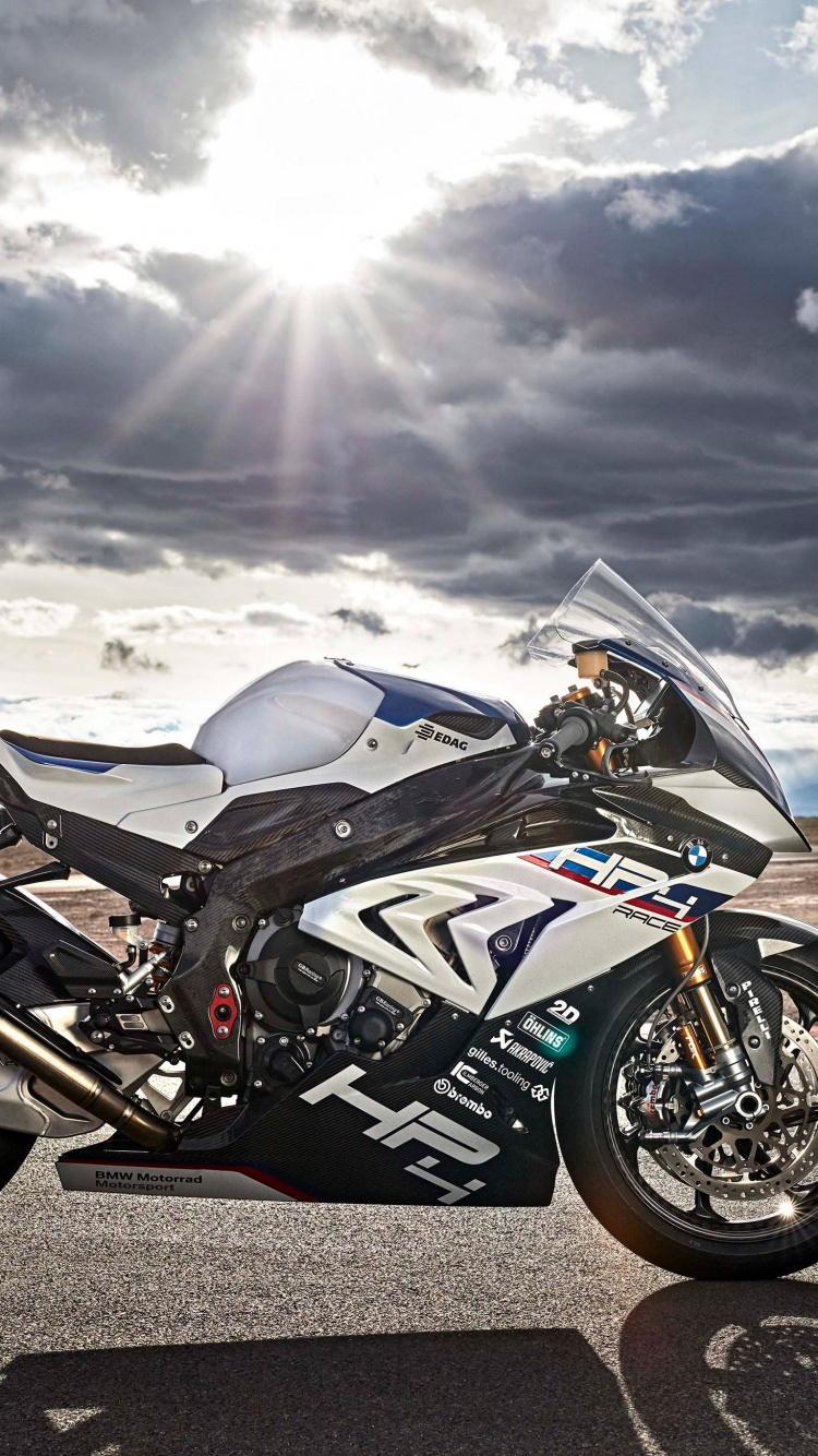 Black and White Sports Bike on Road Under White Clouds and Blue Sky During Daytime. Wallpaper in 750x1334 Resolution