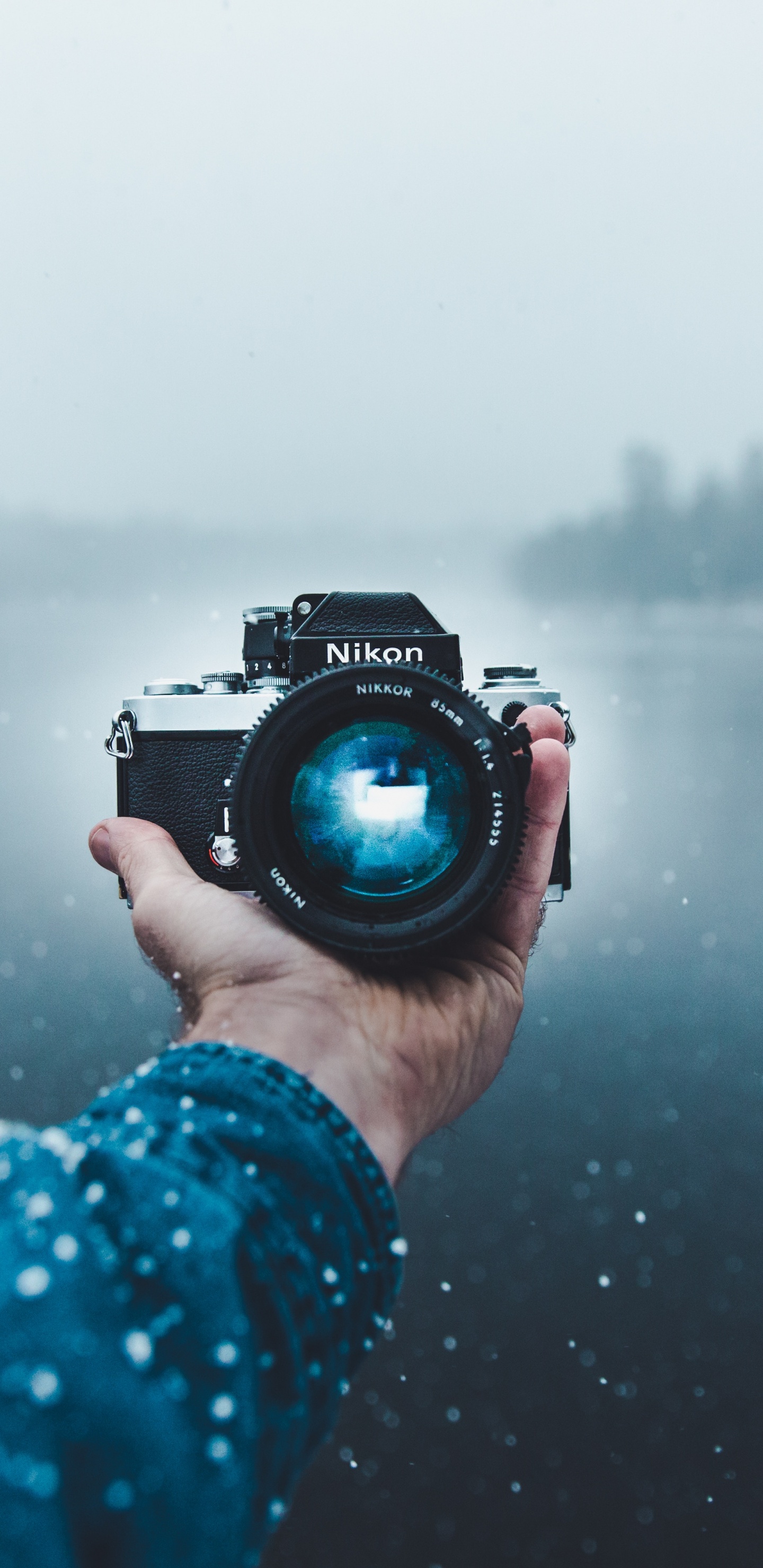 Person Holding Black Dslr Camera. Wallpaper in 1440x2960 Resolution